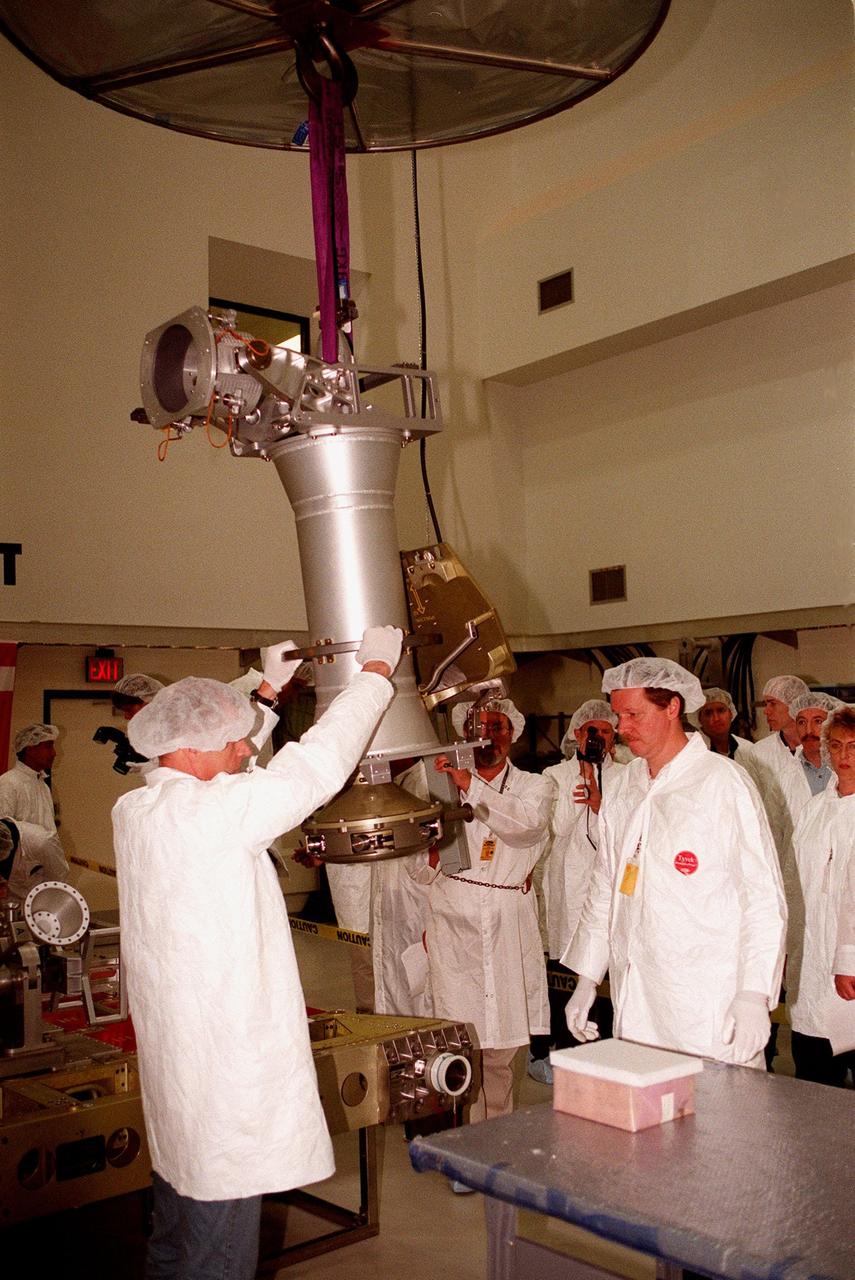 At Astrotech in Titusville, Fla., technicians with DaimlerChrysler Aerospace and RSC Energia of Korolev, Russia, maneuver a Russian cargo crane, the Strela, which is to be mounted to the exterior of the Russian station segment on the International Space Station (ISS). The Strehla has been the focus for two Shuttle crews, STS-96 who are at KSC for a Crew Equipment Interface Test, and STS-101, for payload familiarization. For the first time, STS-96 will include an Integrated Cargo Carrier (ICC) that will carry the Russian cargo crane; the SPACEHAB Oceaneering Space System Box (SHOSS), which is a logistics items carrier; and a U.S.-built crane (ORU Transfer Device, or OTD) that will be stowed on the station for use during future ISS assembly missions. The ICC can carry up to 6,000 lb of unpressurized payload. It was built for SPACEHAB by DaimlerChrysler Aerospace and RSC Energia. STS-96 is targeted for launch on May 24 from Launch Pad 39B. STS-101 is scheduled to launch in early December 1999