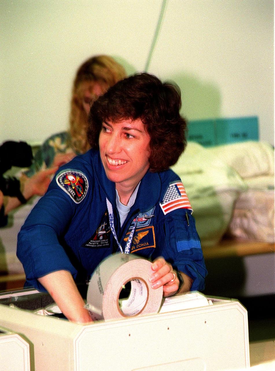 KENNEDY SPACE CENTER, FLA. -- STS-96 Mission Specialist Ellen Ochoa gets a hands-on look at equipment at the SPACEHAB Facility. Members of the STS-96 crew are taking part in a bench review at SPACEHAB as part of familiarization activities for their upcoming mission. The crew also includes Commander Kent V. Rominger, Pilot Rick Husband and Mission Specialists Tamara E. Jernigan, Daniel Barry, Julie Payette and Valery Ivanovich Tokarev. Payette is with the Canadian Space Agency and Tokarev with the Russian Space Agency. Mission STS-96 is the second flight in construction of the International Space Station and will include the SPACEHAB. The 10-day mission is targeted for launch on May 24, 1999, at Launch Pad 39B