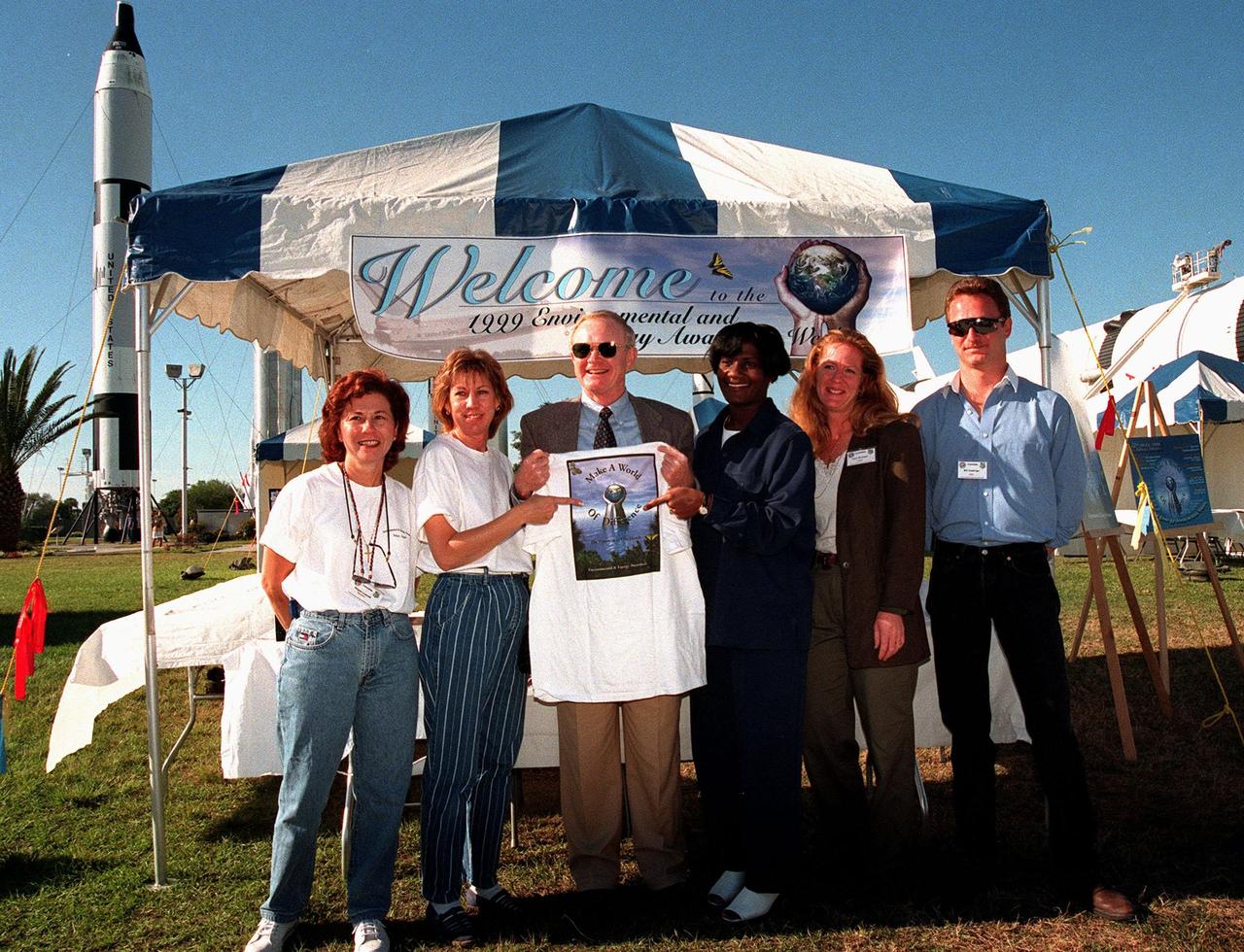 The opening of Environmental and Energy Awareness Week at the Kennedy Space Center Visitor Complex kicked off with a visit by Center Director Roy Bridges and the Awareness team, who presented him with a t-shirt. Exhibits and displays by KSC and 45th Space Wing organizations detail accomplishments in minimizing environmental impacts and conserving resources. They are on view April 19 22 at various sites at KSC, Cape Canaveral Air Station and Patrick Air Force Base