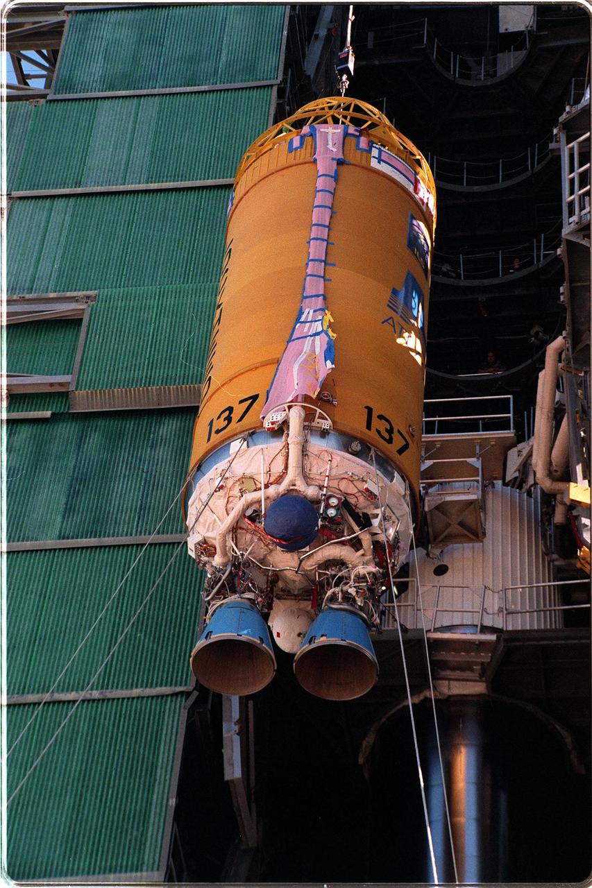 At Launch Pad 36A, Cape Canaveral Air Station, a Centaur upper stage is lifted up the gantry for mating with the lower stage Lockheed Martin Atlas IIA rocket seen behind it. The Lockheed Martin-manufactured Centaur IIA is powered by two Pratt & Whitney turbopump-fed engines, producing a total thrust of 41,600 pounds. The rocket is scheduled to launch the NASA GOES-L satellite on May 15, at the opening of a launch window which extends from 2:23 to 4:41 a.m. EDT. Once in orbit, the satellite will become GOES-11, joining GOES-8, GOES-9 and GOES-10 in space. The fourth of a new advanced series of geostationary weather satellites for the National Oceanic and Atmospheric Administration (NOAA), GOES-L is a three-axis inertially stabilized spacecraft that will provide pictures and perform atmospheric sounding at the same time. Once launched, the satellite will undergo checkout and then provide backup capabilities for the existing, aging operational satellites