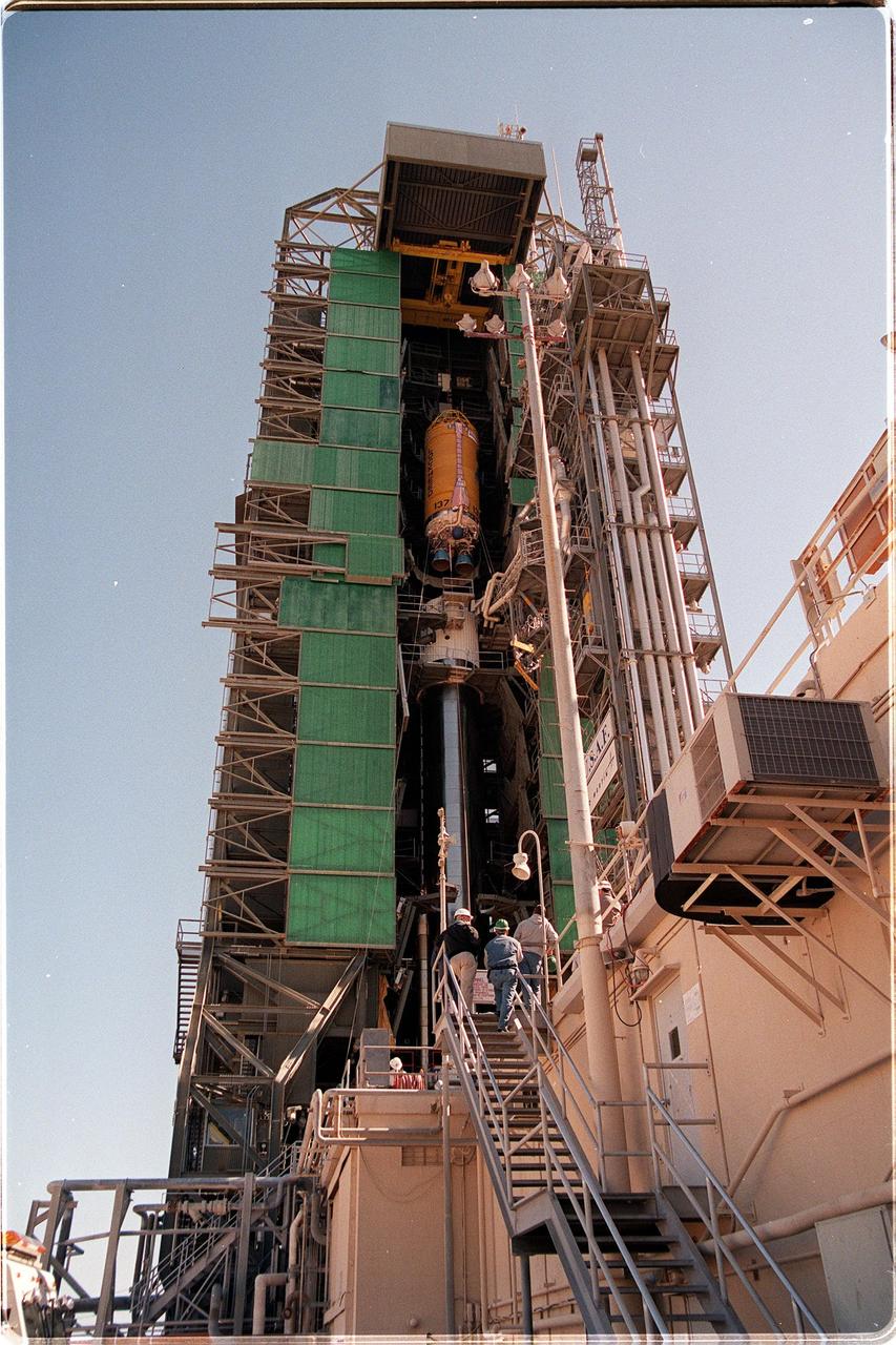 At Launch Pad 36A, Cape Canaveral Air Station, a Centaur upper stage is moved into place above the lower stage Lockheed Martin Atlas IIA rocket. The Lockheed Martin-manufactured Centaur IIA is powered by two Pratt & Whitney turbopump-fed engines, producing a total thrust of 41,600 pounds. The rocket is scheduled to launch the NASA GOES-L satellite on May 15, at the opening of a launch window which extends from 2:23 to 4:41 a.m. EDT. Once in orbit, the satellite will become GOES-11, joining GOES-8, GOES-9 and GOES-10 in space. The fourth of a new advanced series of geostationary weather satellites for the National Oceanic and Atmospheric Administration (NOAA), GOES-L is a three-axis inertially stabilized spacecraft that will provide pictures and perform atmospheric sounding at the same time. Once launched, the satellite will undergo checkout and then provide backup capabilities for the existing, aging operational satellites