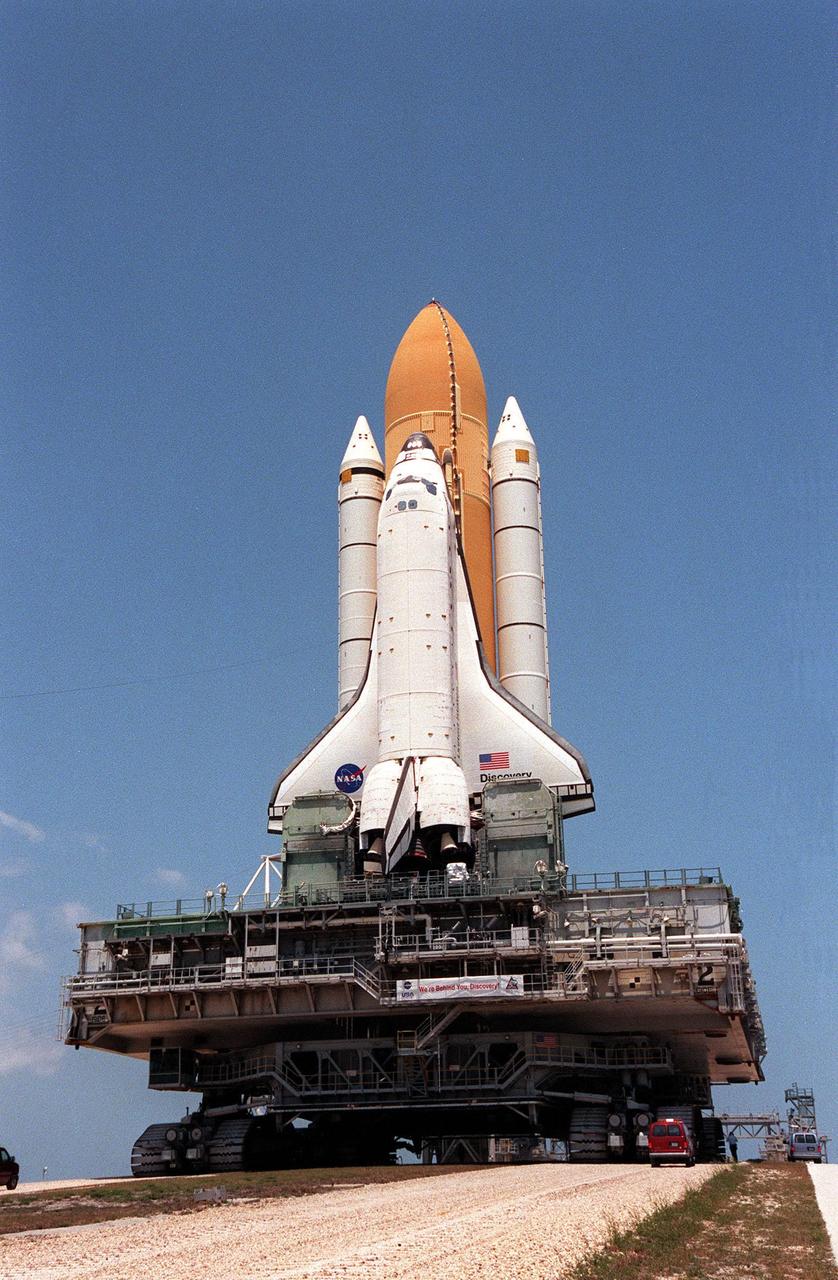 KENNEDY SPACE CENTER, Fla. -- The Space Shuttle Discovery, atop the mobile launcher platform and crawler-transporter, begins the climb up the ramp to Launch Pad 39B. Traveling at 1 mph, the crawler-transporter takes about five hours to cover the journey from the Vehicle Assembly Building to the launch pad. Special levelers on the crawler-transporter keep the Space Shuttle vertical within plus or minus 10 minutes of arc about the dimensions of a basketball. Liftoff of Discovery on mission STS-96 is targeted for May 20 at 9:32 a.m. EDT. STS-96 is a logistics and resupply mission for the International Space Station, carrying such payloads as a Russian crane, the Strela; a U.S.-built crane; the Spacehab Oceaneering Space System Box (SHOSS), a logistics items carrier; and STARSHINE, a student-led experiment