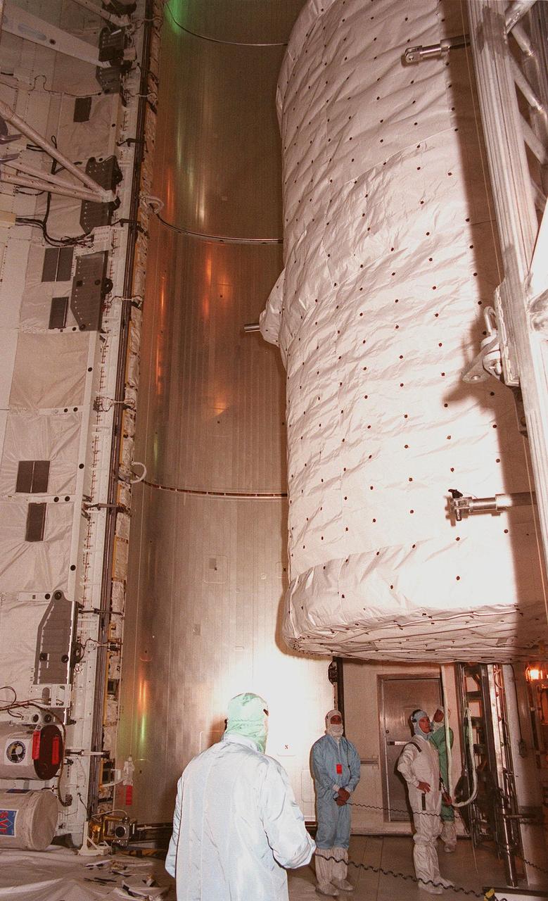 KENNEDY SPACE CENTER, FLA. -- In the payload changeout room at Launch Pad 39B, the SPACEHAB Double module is moved from the payload canister before being placed in Space Shuttle Discovery's payload bay for mission STS-96. The second flight supporting construction of the International Space Station, STS-96 is a logistics and resupply mission, carrying more than 5,000 pounds of supplies, a Russian-built crane and a U.S.-built crane, plus experiments such as STARSHINE, which was developed by and for students. Comprising the crew are Commander Kent V. Rominger, Pilot Rick Douglas Husband, and Mission Specialists Ellen Ochoa (Ph.D.), Tamara E. Jernigan (Ph.D.), Daniel Barry (M.D., Ph.D.), Julie Payette, with the Canadian Space Agency, and Valery Ivanovich Tokarev, with the Russian Space Agency. Liftoff is scheduled for May 20 at 9:32 a.m. EDT