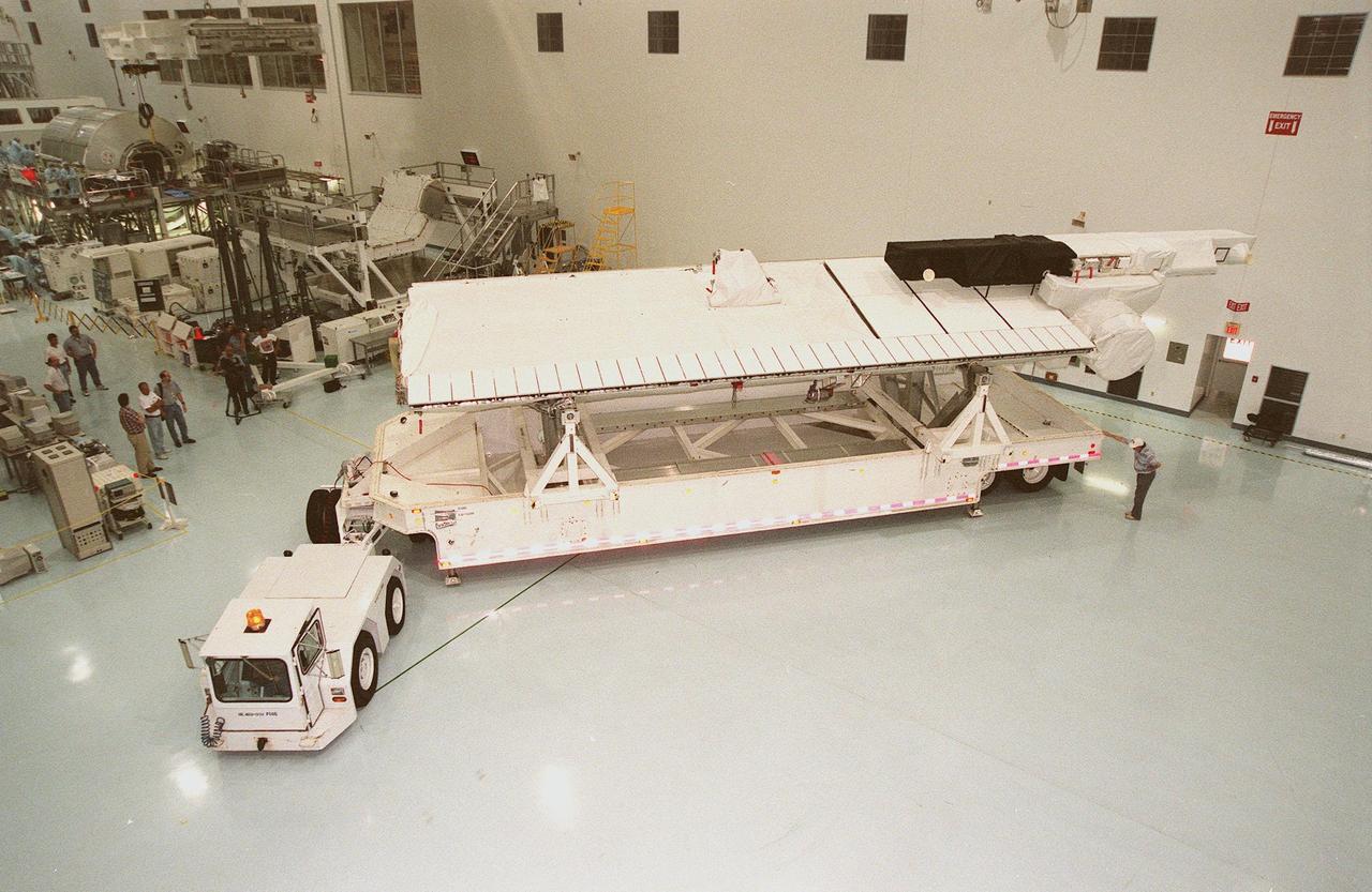 The Shuttle Radar Topography Mission (SRTM) is moved into the Space Station Processing Facility to prepare it for launch targeted for September 1999. The primary payload on mission STS-99, the SRTM consists of a specially modified radar system that will fly onboard the Space Shuttle during the 11-day mission. This radar system will gather data that will result in the most accurate and complete topographic map of the Earth's surface that has ever been assembled. SRTM is an international project spearheaded by the National Imagery and Mapping Agency and NASA, with participation of the German Aerospace Center DLR. Its objective is to obtain the most complete high-resolution digital topographic database of the Earth