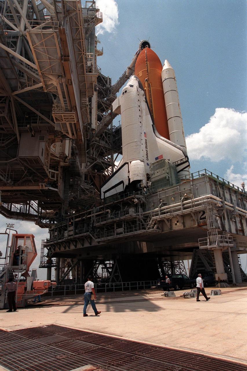 KENNEDY SPACE CENTER, FLA. -- The Rotating Service Structure is rolled back at Launch Pad 39B to reveal the Space Shuttle Discovery, scheduled to launch on mission STS-96 at 6:49 a.m. EDT on May 27. STS-96 is a 10-day logistics and resupply mission for the International Space Station, carrying about 4,000 pounds of supplies to be stored aboard the station, for use by future crews, including laptop computers, cameras, tools, spare parts, and clothing. The mission also includes such payloads as a Russian crane, the Strela; a U.S.-built crane; the Spacehab Oceaneering Space System Box (SHOSS), a logistics items carrier; and STARSHINE, a student-involved experiment. The mission will include a space walk to attach the cranes to the outside of the ISS for use in future construction. Space Shuttle Discovery is due to launch on May 27 at 6:49 a.m. EDT. Landing is expected at the SLF on June 6 about 1:58 a.m. EDT