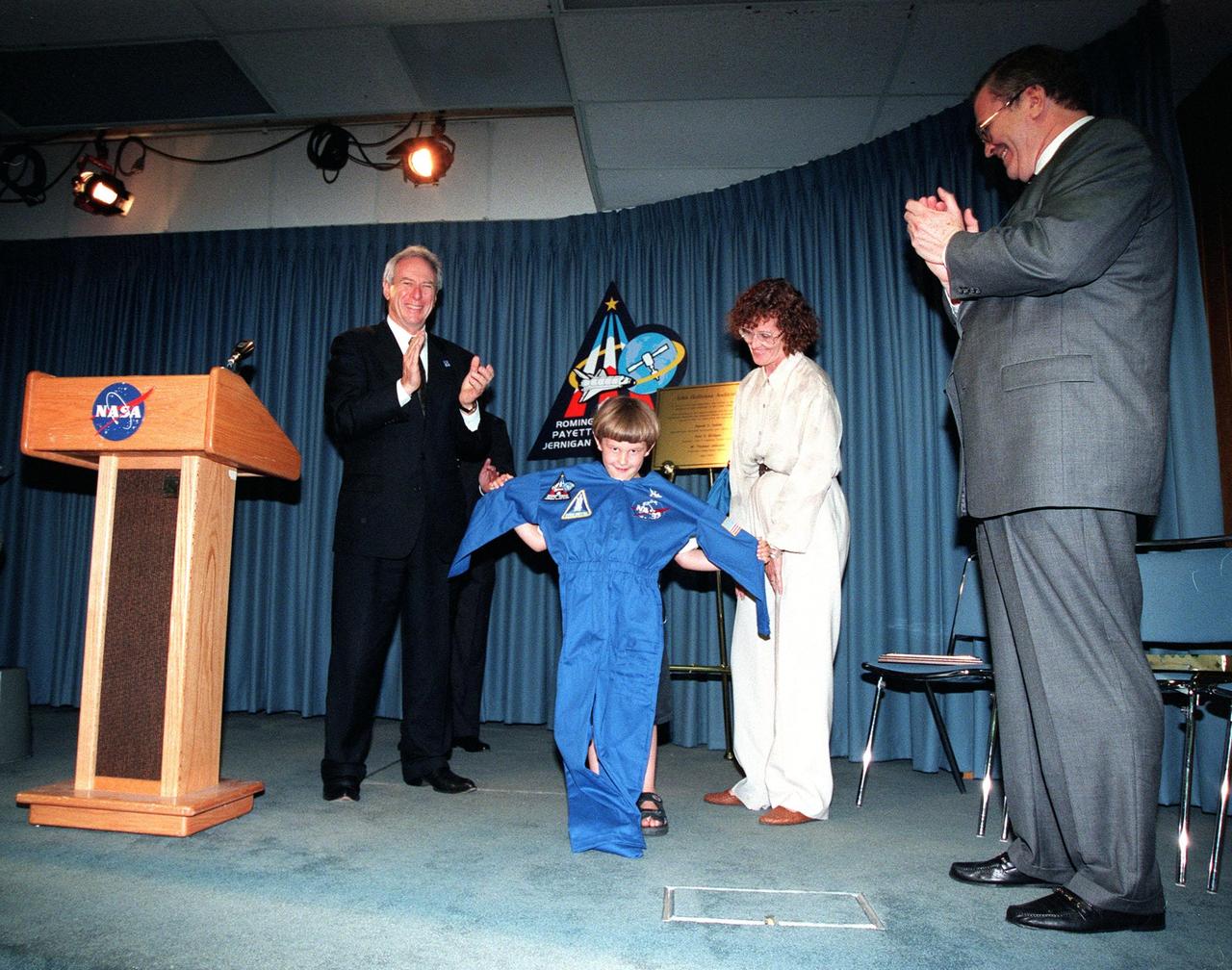 A ceremony dedicated the KSC Press Site auditorium as the John Holliman Auditorium to honor the correspondent for his enthusiastic, dedicated coverage of America's space program. The auditorium was built in 1980 and has been the focal point for news coverage of Space Shuttle launches. The ceremony followed the 94th launch of a Space Shuttle, on mission STS-96, earlier this morning