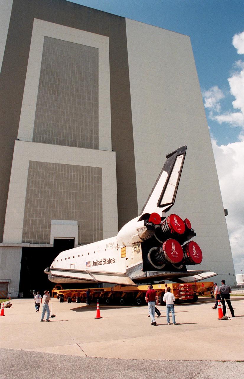 KENNEDY SPACE CENTER, FLA. -- The orbiter Columbia, aboard its orbiter transporter system, rolls toward the opening in the Vehicle Assembly Building where it will undergo external tank mating operations. Columbia is scheduled for rollout to Launch Pad 39B on Monday, June 7, for mission STS-93. The primary mission objective will be the deployment of the Advanced X-ray Astrophysics Facility, recently renamed the Chandra X-Ray Observatory. Mission STS-93 will be the first Space Shuttle commanded by a woman, Commander Eileen M. Collins. It is scheduled to launch July 22 at 12:27 a.m. EDT although that date is currently under review