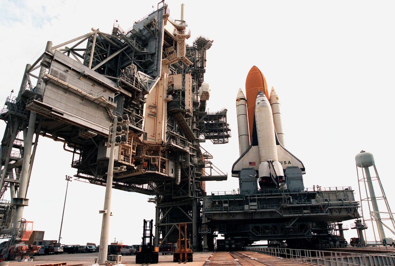KENNEDY SPACE CENTER, FLA. -- This closeup of Space Shuttle Columbia on Launch Pad 39B shows the Rotating Service Structure, at left, which will be moved into place on Tuesday, June 8. Columbia was rolled out June 7, less than two weeks after the liftoff of Discovery on mission STS-96, in preparation for the launch of STS-93. The mission payload is the Chandra X-ray Observatory, the world's most powerful X-ray telescope, which will allow scientists from around the world to see previously invisible black holes and high-temperature gas clouds, giving the observatory the potential to rewrite the books on the structure and evolution of our universe. Columbia (OV-102) is the first of NASA's orbiter fleet, delivered to Kennedy Space Center in March 1979. Columbia initiated the Space Shuttle flight program at KSC when it lifted off Launch Pad 39A on April 12, 1981