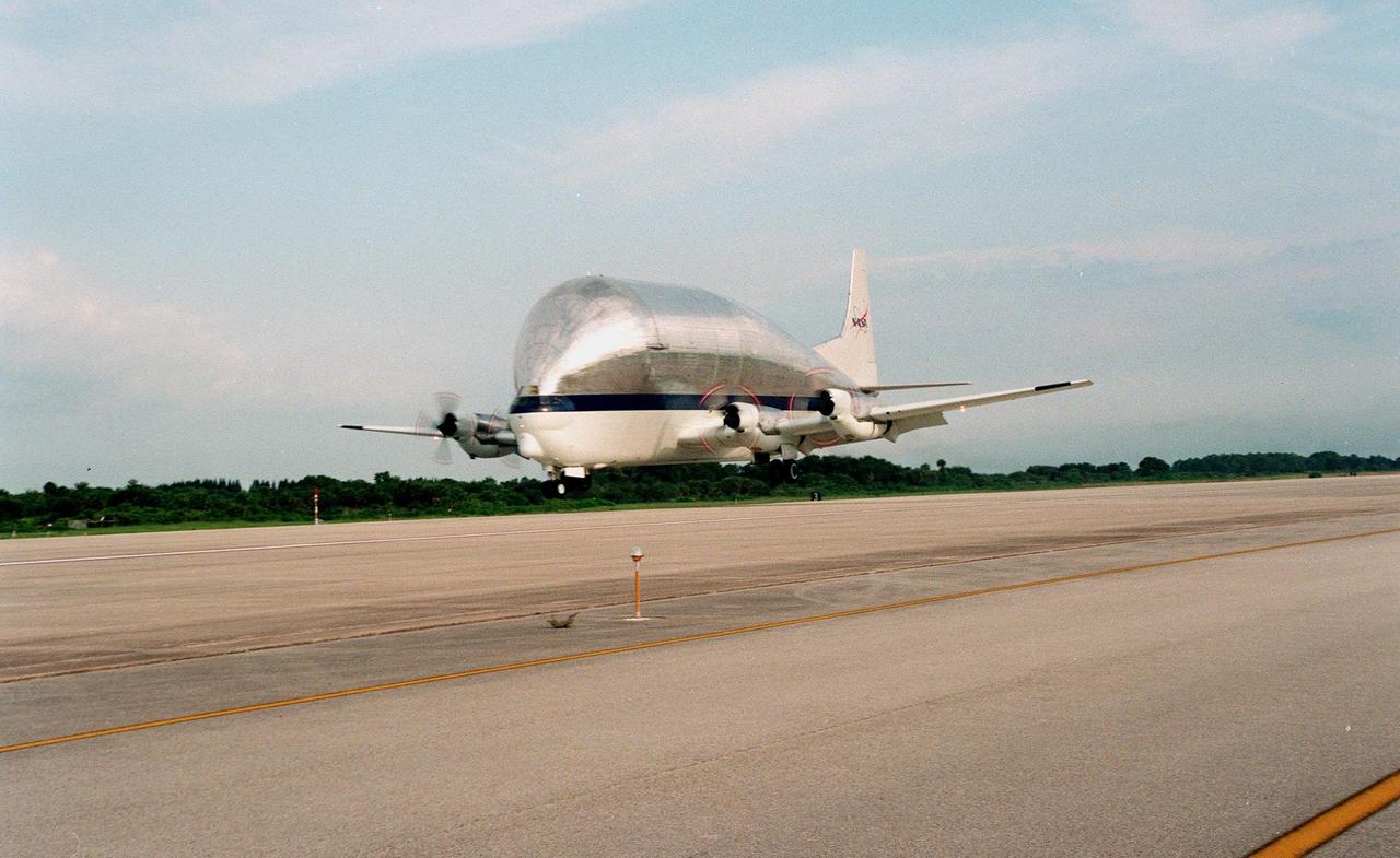 KENNEDY SPACE CENTER, FLA. -- The "Super Guppy" transport aircraft approaches the runway at the KSC's Shuttle Landing Facility. On board is the S0 (S Zero) truss segment, from Boeing in Huntington Beach, Calif. The truss segment, which will become the backbone of the orbiting International Space Station (ISS), is a 44- by 15-foot structure weighing 30,800 pounds when fully outfitted and ready for launch. It will be at the center of the 10-truss, girderlike structure that will ultimately extend the length of a football field on the ISS. Eventually the S0 truss will be attached to the U.S. Lab, "Destiny," scheduled to be added to the ISS in April 2000. Later, other trusses will be attached to the S0 truss on-orbit. During processing at KSC, the S0 truss will have installed the Canadian Mobile Transporter, power distribution system modules, a heat pipe radiator for cooling, computers, and a pair of rate gyroscopes. Four Global Positioning System antennas are already installed. The S0 truss is scheduled to be launched in the first quarter of 2001 on mission STS-108