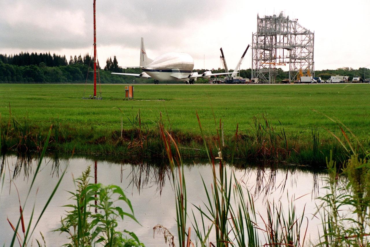 KENNEDY SPACE CENTER, FLA. -- At KSC's Shuttle Landing Facility, the "Super Guppy" transport aircraft touches down on the runway. On board the aircraft is the S0 (S Zero) truss segment, from Boeing in Huntington Beach, Calif. The truss segment, which will become the backbone of the orbiting International Space Station (ISS), is a 44by 15-foot structure weighing 30,800 pounds when fully outfitted and ready for launch. It will be at the center of the ISS 10-truss, girderlike structure that will ultimately extend the length of a football field. Eventually the S0 truss will be attached to the U.S. Lab, "Destiny," which is scheduled to be added to the ISS in April 2000. Later, other trusses will be attached to the S0 on-orbit. During processing at KSC, the S0 truss will have installed the Canadian Mobile Transporter, power distribution system modules, a heat pipe radiator for cooling, computers, and a pair of rate gyroscopes. Four Global Positioning System antennas are already installed. The S0 truss is scheduled to be launched in the first quarter of 2001 on mission STS-108