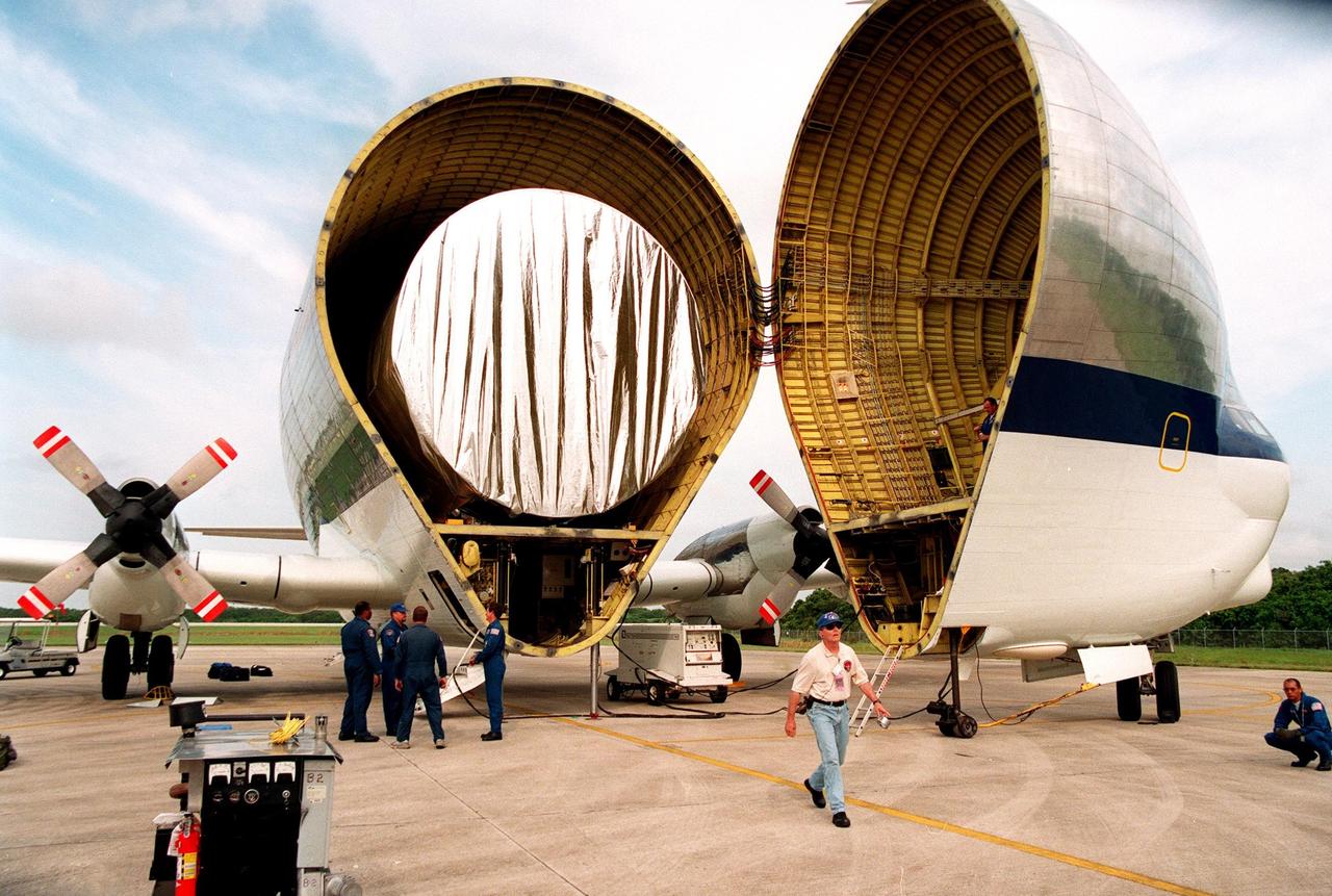 KENNEDY SPACE CENTER, FLA. -- After landing at KSC's Shuttle Landing Facility, the "Super Guppy" transport aircraft opens to reveal its cargo, a S0 (S Zero) truss segment, from Boeing in Huntington Beach, Calif. The truss segment, which will become the backbone of the orbiting International Space Station (ISS), is a 44by 15-foot structure weighing 30,800 pounds when fully outfitted and ready for launch. It will be at the center of the ISS 10-truss, girderlike structure that will ultimately extend the length of a football field. Eventually the S0 truss will be attached to the U.S. Lab, "Destiny," which is scheduled to be added to the ISS in April 2000. Later, other trusses will be attached to the S0 on-orbit. During processing at KSC, the S0 truss will have installed the Canadian Mobile Transporter, power distribution system modules, a heat pipe radiator for cooling, computers, and a pair of rate gyroscopes. Four Global Positioning System antennas are already installed. The S0 truss is scheduled to be launched in the first quarter of 2001 on mission STS-108