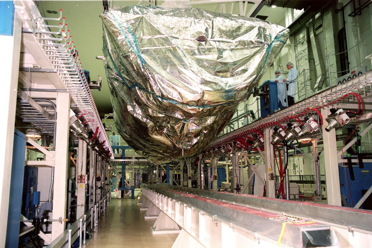 KENNEDY SPACE CENTER, FLA. -- The S0 truss nears its resting place in the workstand in the O&C Bldg. (O&C). The S0 truss will undergo processing in the O&C during which the Canadian Mobile Transporter, power distribution system modules, a heat pipe radiator for cooling, computers, and a pair of rate gyroscopes will be installed. Four Global Positioning System antennas are already installed. A 44by 15-foot structure weighing 30,800 pounds when fully outfitted and ready for launch, the truss will be at the center of the ISS 10-truss, girderlike structure that will ultimately extend the length of a football field. Eventually the S0 truss will be attached to the U.S. Lab, "Destiny," which is scheduled to be added to the ISS in April 2000. Later, other trusses will be attached to the S0 on-orbit. The S0 truss is scheduled to be launched in the first quarter of 2001 on mission STS-108