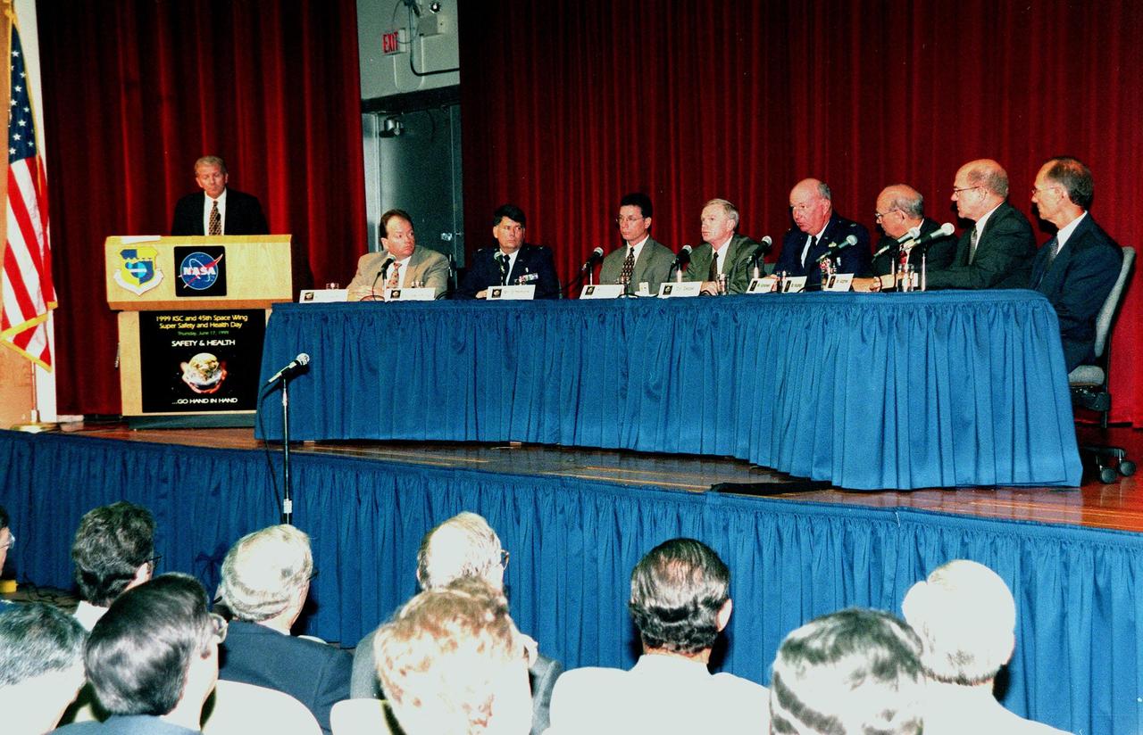A panel of NASA and contractor senior staff, plus officers from the 45th Space Wing, discuss safetyand health-related concerns in front of an audience of KSC employees, as part of Super Safety and Health Day. Moderating at the podium is Loren Shriver, deputy director for Launch & Payload Processing. Seated left to right are Burt Summerfield, associate director of the Biomedical Office; Colonel William S. Swindling, commander, 45th Medical Group, Patrick Air Force Base, Fla.; Ron Dittemore, manager, Space Shuttle Programs, Johnson Space Center; Roy Bridges, Center Director; Col. Tom Deppe, vice commander, 45th Space Wing, Patrick Air Force Base; Jim Schoefield, program manager, Payload Ground Operations, Boeing; Bill Hickman, program manager, Space Gateway Support; and Ed Adamek, vice president and associate program manager for Ground Operations, United Space Alliance. The panel was one of the presentations during KSC's second annual day-long dedication to safety. Most normal work activities were suspended to allow personnel to attend related activities. The theme, "Safety and Health Go Hand in Hand," emphasized KSC's commitment to place the safety and health of the public, astronauts, employees and space-related resources first and foremost. Events also included a keynote address, vendor exhibits, and safety training in work groups. The keynote address and panel session were also broadcast internally over NASA television