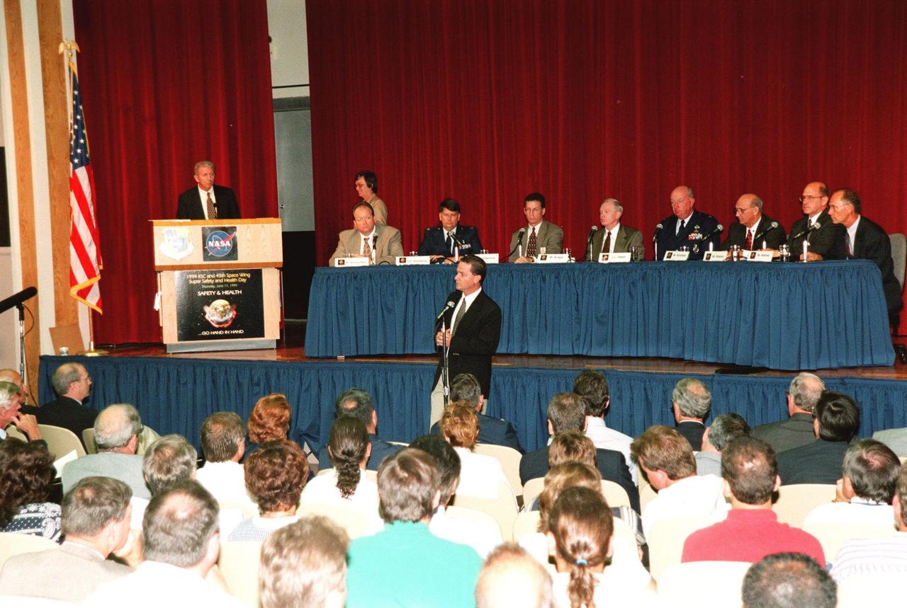 A panel of NASA and contractor senior staff, plus officers from the 45th Space Wing, discuss safetyand health-related concerns in front of an audience of KSC employees as part of Super Safety and Health Day. Moderating at the podium is Loren Shriver, deputy director for Launch & Payload Processing. Seated left to right are Burt Summerfield, associate director of the Biomedical Office; Colonel William S. Swindling, commander, 45th Medical Group, Patrick Air Force Base, Fla.; Ron Dittemore, manager, Space Shuttle Programs, Johnson Space Center; Roy Bridges, Center Director; Col. Tom Deppe, vice commander, 45th Space Wing, Patrick Air Force Base; Jim Schoefield, program manager, Payload Ground Operations, Boeing; Bill Hickman, program manager, Space Gateway Support; and Ed Adamek, vice president and associate program manager for Ground Operations, United Space Alliance. Answering a question at the microphone on the floor is Dave King, director, Shuttle Processing. The panel was one of the presentations during KSC's second annual day-long dedication to safety. Most normal work activities were suspended to allow personnel to attend related activities. The theme, "Safety and Health Go Hand in Hand," emphasized KSC's commitment to place the safety and health of the public, astronauts, employees and space-related resources first and foremost. Events also included a keynote address, vendor exhibits, and safety training in work groups. The keynote address and panel session were also broadcast internally over NASA television