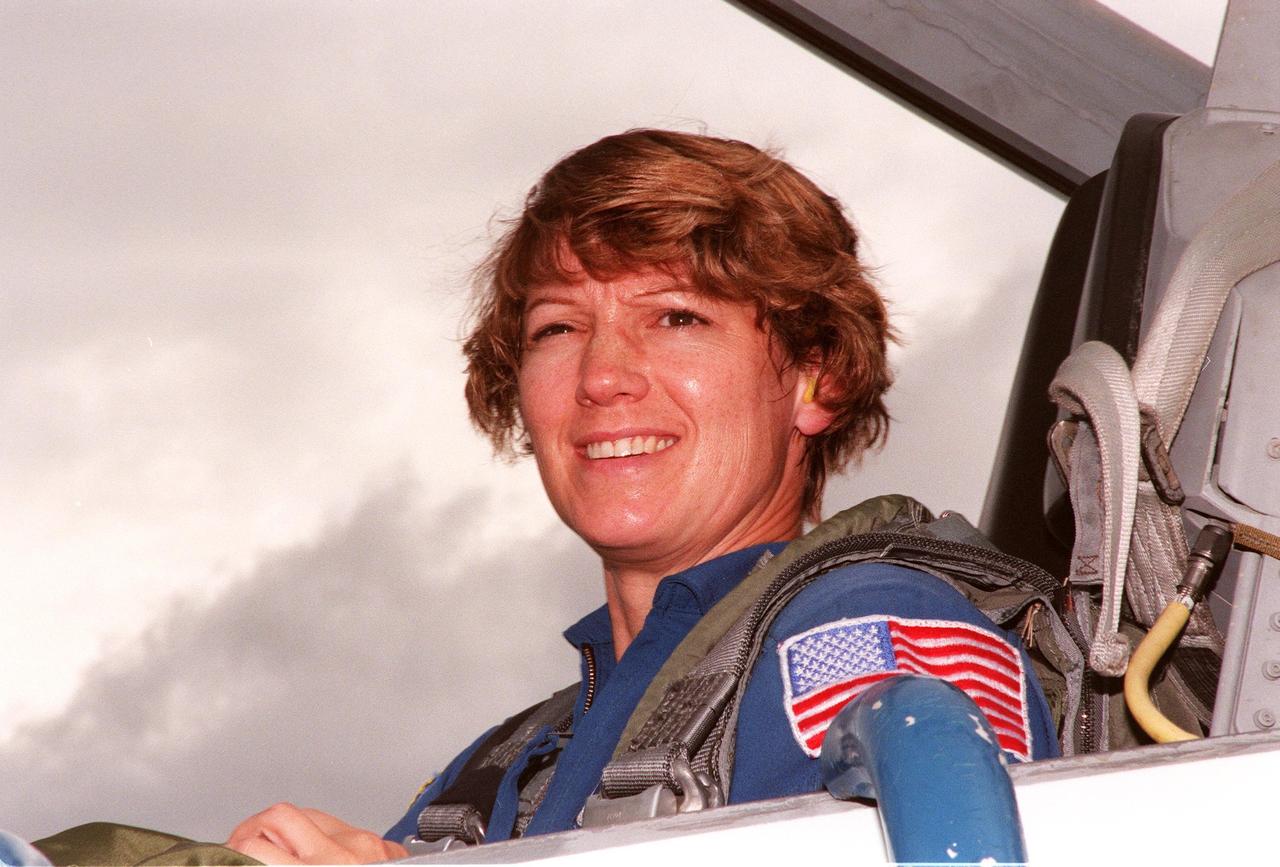 STS-93 Commander Eileen M. Collins smiles on her arrival at KSC's Shuttle Landing Facility aboard a T-38 jet aircraft to participate in Terminal Countdown Demonstration Tests (TCDT) this week. TCDT activities familiarize the crew with the mission, provide training in emergency exit from the orbiter and launch pad, and include a launch-day dress rehearsal culminating with a simulated main engine cut-off. Joining Collins are Pilot Jeffrey S. Ashby and Mission Specialists Steven A. Hawley (Ph.D.), Catherine G. Coleman (Ph.D.) and Michel Tognini of France, with the Centre National d'Etudes Spatiales (CNES). Collins is the first woman to serve as mission commander. The primary mission of STS-93 is the release of the Chandra X-ray Observatory, which will allow scientists from around the world to obtain unprecedented X-ray images of exotic environments in space to help understand the structure and evolution of the universe. Chandra is expected to provide unique and crucial information on the nature of objects ranging from comets in our solar system to quasars at the edge of the observable universe. Since X-rays are absorbed by the Earth's atmosphere, space-based observatories are necessary to study these phenomena and allow scientists to analyze some of the greatest mysteries of the universe