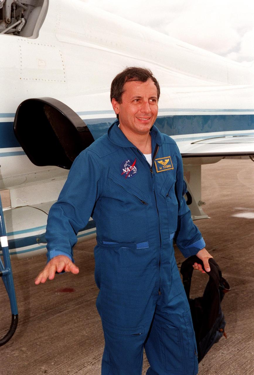 STS-93 Michel Tognini of France arrives at KSC's Shuttle Landing Facility to participate in Terminal Countdown Demonstration Tests (TCDT) this week. TCDT activities familiarize the crew with the mission, provide training in emergency exit from the orbiter and launch pad, and include a launch-day dress rehearsal culminating with a simulated main engine cut-off. Joining Tognini are Commander Eileen M. Collins, Pilot Jeffrey S. Ashby, and Mission Specialists Catherine G. Coleman (Ph.D.) and Steven A. Hawley (Ph.D.). Tognini represents the Centre National d'Etudes Spatiales (CNES). Collins is the first woman to serve as mission commander. The primary mission of STS-93 is the release of the Chandra X-ray Observatory, which will allow scientists from around the world to obtain unprecedented X-ray images of exotic environments in space to help understand the structure and evolution of the universe. Chandra is expected to provide unique and crucial information on the nature of objects ranging from comets in our solar system to quasars at the edge of the observable universe. Since X-rays are absorbed by the Earth's atmosphere, space-based observatories are necessary to study these phenomena and allow scientists to analyze some of the greatest mysteries of the universe