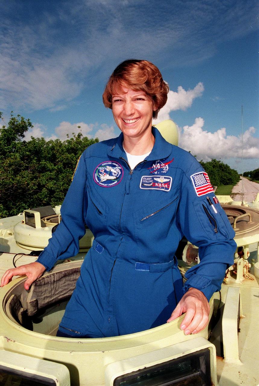 STS-93 Commander Eileen M. Collins climbs into an M-113 armored personnel carrier at the launch pad to take part in emergency egress training. Collins is the first woman to serve as mission commander. In preparation for their mission, the STS-93 crew are participating in Terminal Countdown Demonstration Test activities that also include a launch-day dress rehearsal culminating with a simulated main engine cut-off. Others in the crew are Pilot Jeffrey S. Ashby and Mission Specialists Steven A. Hawley (Ph.D.), Catherine G. Coleman (Ph.D.), and Michel Tognini of France, who represents the Centre National d'Etudes Spatiales (CNES). The primary mission of STS-93 is the release of the Chandra X-ray Observatory, which will allow scientists from around the world to obtain unprecedented X-ray images of exotic environments in space to help understand the structure and evolution of the universe. Chandra is expected to provide unique and crucial information on the nature of objects ranging from comets in our solar system to quasars at the edge of the observable universe. Since X-rays are absorbed by the Earth's atmosphere, space-based observatories are necessary to study these phenomena and allow scientists to analyze some of the greatest mysteries of the universe. The targeted launch date for STS-93 is no earlier than July 20 at 12:36 a.m. EDT from Launch Pad 39B