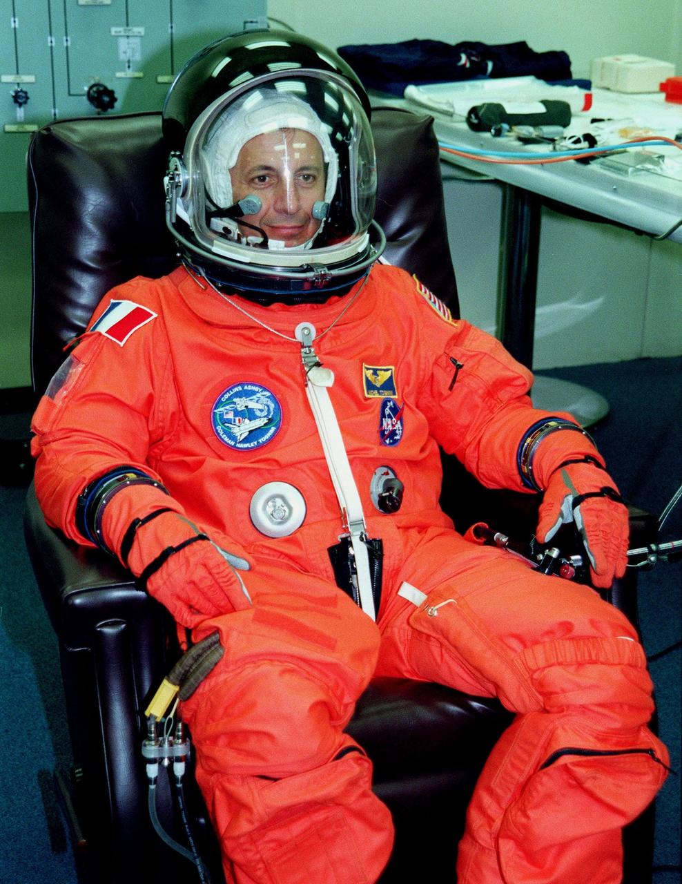 During launch and entry suit check in the Operations and Checkout Bldg, STS-93 Mission Specialist Michel Tognini of France, who represents the Centre National d'Etudes Spatiales (CNES), tries on his helmet. In preparation for their mission, the STS-93 crew are participating in Terminal Countdown Demonstration Test activities that also include equipment check and a launch-day dress rehearsal culminating with a simulated main engine cut-off. Others in the crew participating are Commander Eileen M. Collins, Pilot Jeffrey S. Ashby, and Mission Specialists Steven A. Hawley (Ph.D.) and Catherine G. Coleman (Ph.D.). Collins is the first woman to serve as a Shuttle commander. The primary mission of STS-93 is the release of the Chandra X-ray Observatory, which will allow scientists from around the world to obtain unprecedented X-ray images of exotic environments in space to help understand the structure and evolution of the universe. The targeted launch date for STS-93 is no earlier than July 20 at 12:36 a.m. EDT from Launch Pad 39B