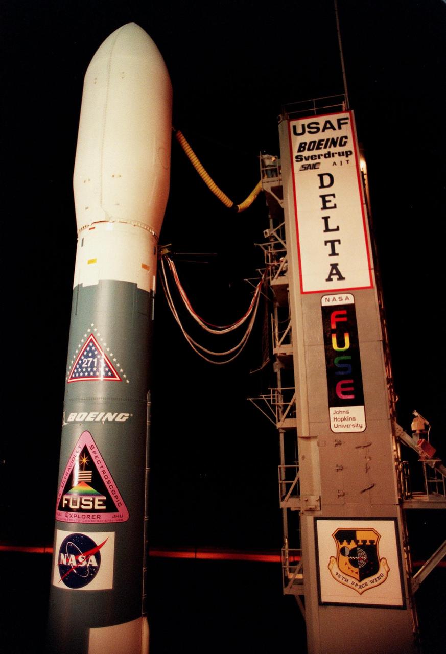 As light peers over the horizon at the crack of dawn, NASA's Far Ultraviolet Spectroscopic Explorer (FUSE) satellite waits for launch on Launch Pad 17A, Cape Canaveral Air Station, aboard the Boeing Delta II rocket. Liftoff is scheduled for 11:39 a.m. EDT. FUSE was developed to investigate the origin and evolution of the lightest elements in the universe hydrogen and deuterium. In addition, the FUSE satellite will examine the forces and process involved in the evolution of the galaxies, stars and planetary systems by investigating light in the far ultraviolet portion of the electromagnetic spectrum