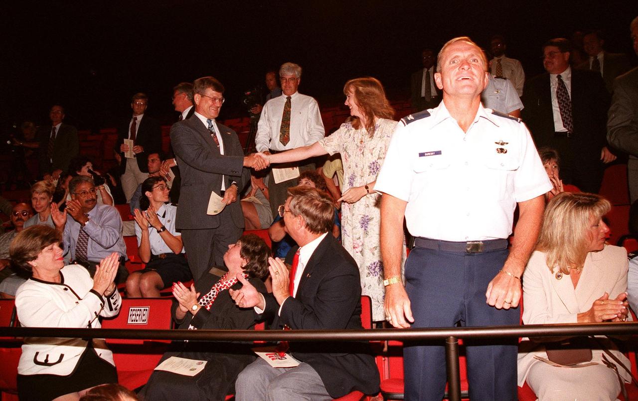 At a special presentation in the IMAX 2 Theater in the Kennedy Space Center Visitor Complex, KSC and 45th Space Wing employees share the honors as recipients of the Hammer Award. The Hammer Award is Vice President Al Gore's special recognition of teams of federal employees who have made significant contributions in support of the principles of the National Partnership for Reinventing Government. Morley Winograd, director of the National Partnership for Reinventing Government, presented the award to Ed Gormel and Chris Fairey, co-chairs of the Joint Base Operations and Support Contract (J-BOSC) Source Evaluation Board (SEB. This Hammer Award acknowledges the accomplishments of a joint NASA and Air Force team that established the J-BOSC SEB. The team developed and implemented the acquisition strategy for establishing a single set of base operations and support service requirements for KSC, Cape Canaveral Air Station and Patrick Air Force Base