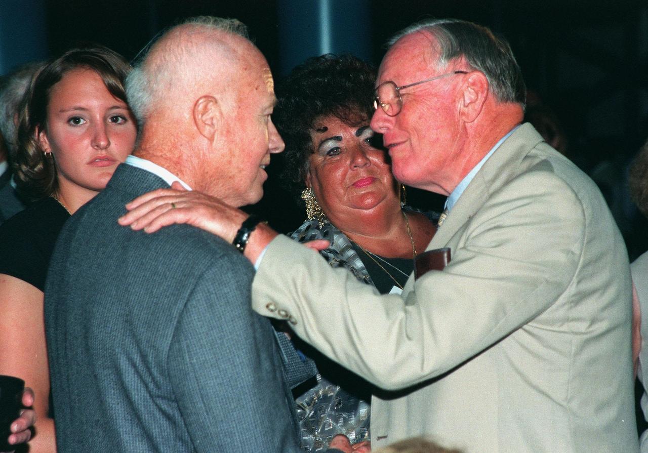 KENNEDY SPACE CENTER, FLA. -- Former Apollo 11 astronaut Neil A. Armstrong talks with a former Apollo team member during an anniversary banquet honoring the Apollo team, the people who made the entire lunar landing program possible. The banquet was held in the Apollo/Saturn V Center, part of the KSC Visitor Complex. This is the 30th anniversary of the Apollo 11 launch and moon landing, July 16 and July 20, 1969. Neil Armstrong was the first man to set foot on the moon