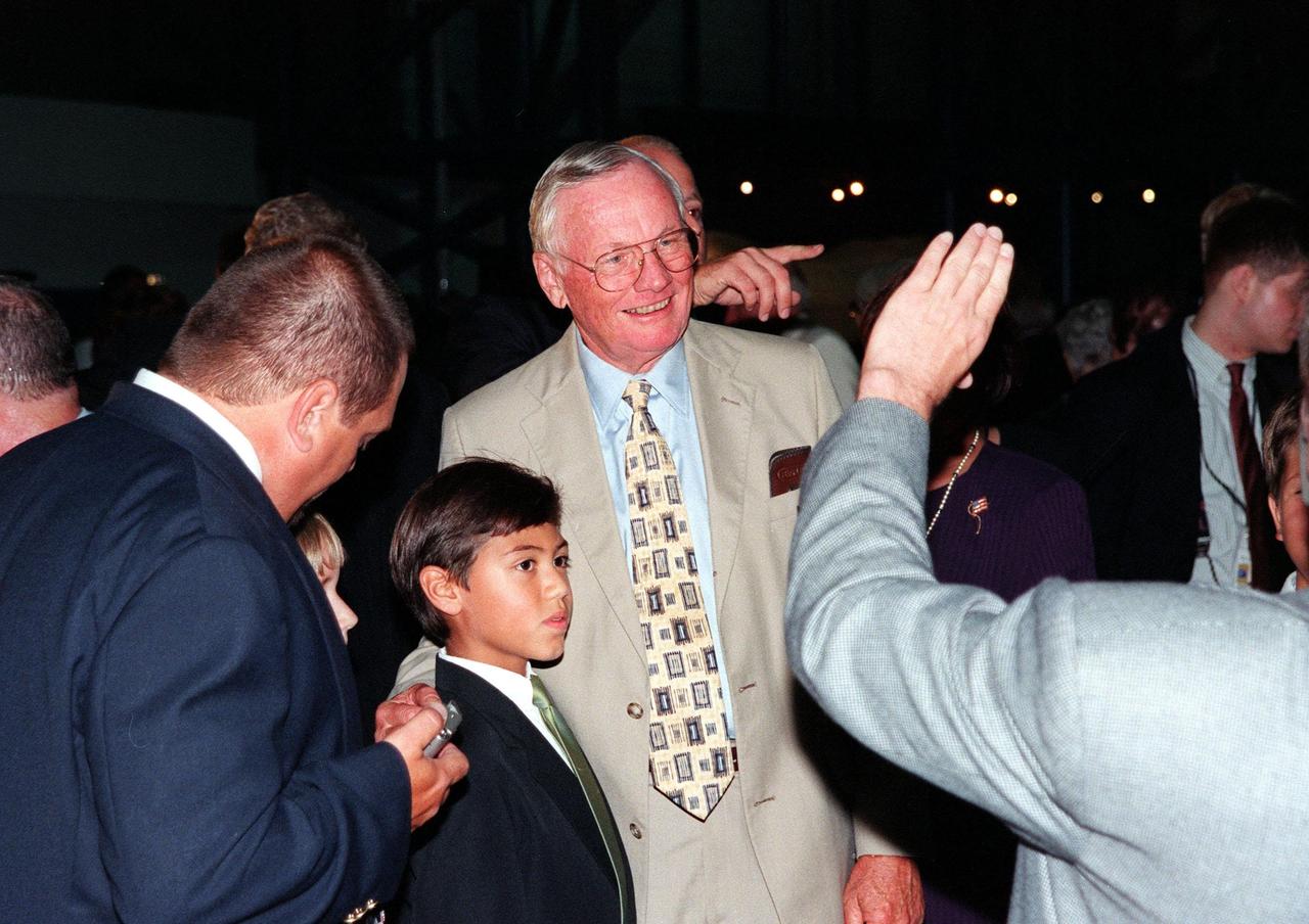 KENNEDY SPACE CENTER, FLA. -- Former Apollo 11 astronaut Neil A. Armstrong poses for a photograph with fans who attended the anniversary banquet honoring the Apollo team, the people who made the entire lunar landing program possible. The banquet was held in the Apollo/Saturn V Center, part of the KSC Visitor Complex. This is the 30th anniversary of the Apollo 11 launch and moon landing, July 16 and July 20, 1969. Neil Armstrong was the first man to set foot on the moon
