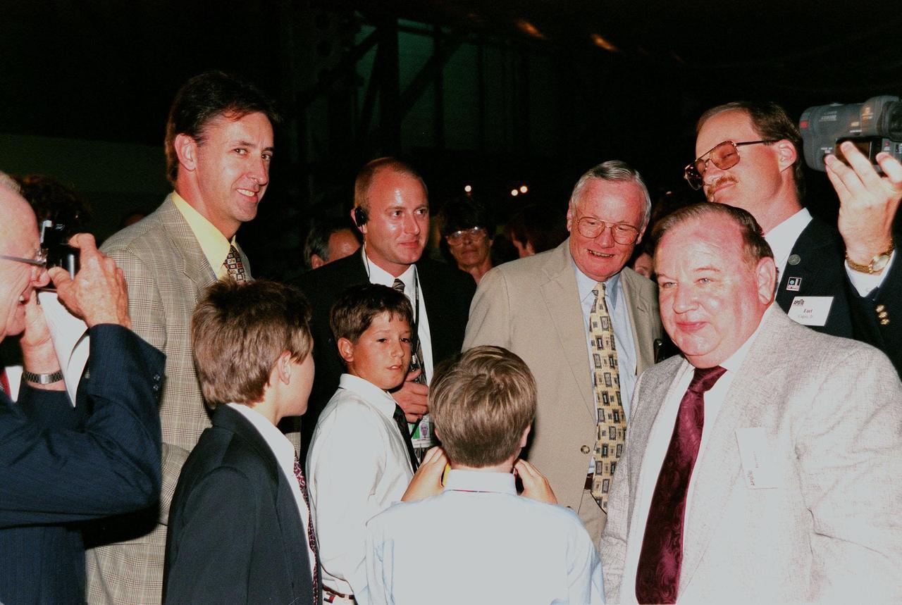 KENNEDY SPACE CENTER, FLA. -- Former Apollo 11 astronaut Neil A. Armstrong is the center of attention at the anniversary banquet honoring the Apollo team, the people who made the entire lunar landing program possible. The banquet was held in the Apollo/Saturn V Center, part of the KSC Visitor Complex. This is the 30th anniversary of the Apollo 11 launch and moon landing, July 16 and July 20, 1969. Neil Armstrong was the first man to set foot on the moon. He appeared at the banquet with other former astronauts Edwin "Buzz" Aldrin, Gene Cernan, Walt Cunningham and others