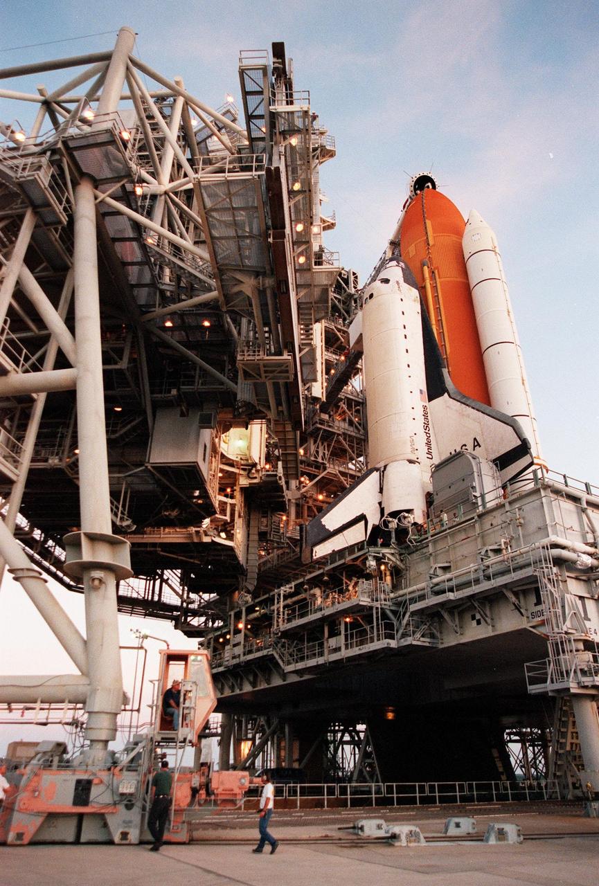 The Rotating Service Structure is rolled back from Space Shuttle Columbia on Launch Pad 39-B, in preparation for launch of mission STS-93 July 20 at 12:36 a.m. EDT. The primary payload of STS-93 is the Chandra X-ray Observatory, which will allow scientists from around the world to study some of the most distant, powerful and dynamic objects in the universe. The new telescope is 20 to 50 times more sensitive than any previous X-ray telescope and is expected unlock the secrets of supernovae, quasars and black holes. The STS-93 crew numbers five: Commander Eileen M. Collins, Pilot Jeffrey S. Ashby, and Mission Specialists Steven A. Hawley (Ph.D.), Catherine G. Coleman (Ph.D.) and Michel Tognini of France, with the Centre National d'Etudes Spatiales (CNES). Collins is the first woman to serve as commander of a shuttle mission