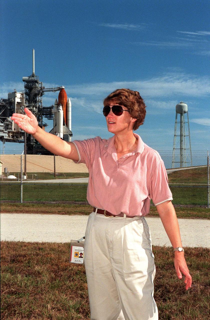 STS-93 Commander Eileen M. Collins waves to her family nearby, a last meeting before launch of mission STS-93 on July 20. Liftoff is scheduled for 12:36 a.m. EDT. The primary mission of STS-93 is the release of the Chandra X-ray Observatory, which will allow scientists from around the world to study some of the most distant, powerful and dynamic objects in the universe. The new telescope is 20 to 50 times more sensitive than any previous X-ray telescope and is expected to unlock the secrets of supernovae, quasars and black holes. The STS-93 crew numbers five: Commander Collins, Pilot Jeffrey S. Ashby, and Mission Specialists Steven A. Hawley (Ph.D.), Catherine G. Coleman (Ph.D.) and Michel Tognini of France, with the Centre National d'Etudes Spatiales (CNES). Collins is the first woman to serve as commander of a shuttle mission