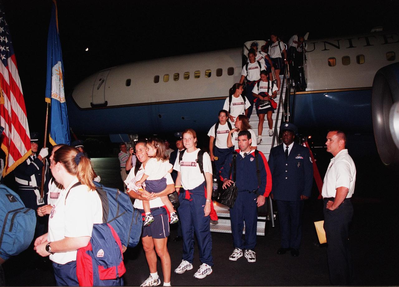 KENNEDY SPACE CENTER, FLA. -- Members of the U.S. Women's World Cup Soccer Team are greeted by NASA Administrator Daniel S. Goldin as they disembark from a plane at the Skid Strip at Cape Canaveral Air Station. They arrived with First Lady Hillary Rodham Clinton to view the launch of Space Shuttle mission STS-93 scheduled for 12:36 a.m. EDT July 20. Much attention has been generated over the launch due to Commander Eileen M. Collins, the first woman to serve as commander of a Shuttle mission. The primary payload of the five-day mission is the release of the Chandra X-ray Observatory, which will allow scientists from around the world to study some of the most distant, powerful and dynamic objects in the universe