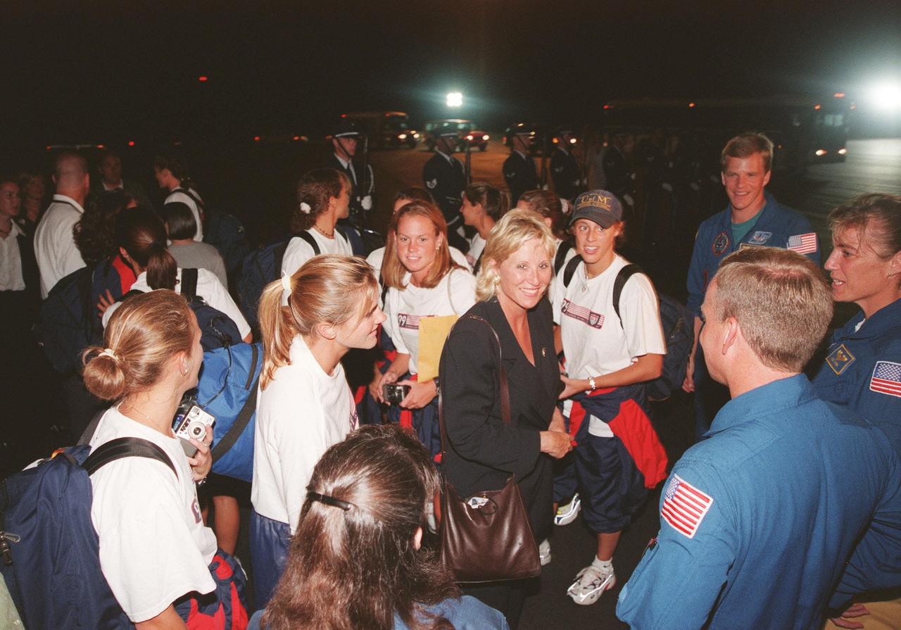 Members of the U.S. Women's World Cup Soccer Team were greeted upon their arrival at the Skid Strip at Cape Canaveral Air Station by Astronauts (right) Steven W. Lindsey, Heidemarie M. Stefanyshyn-Piper and Scott E. Parzynski. The team are here to view the launch of Space Shuttle mission STS-93, scheduled for 12:36 a.m. EDT July 20. Much attention has been generated over the launch due to Commander Eileen M. Collins, the first woman to serve as commander of a Shuttle mission. The primary payload of the five-day mission is the Chandra X-ray Observatory, which will allow scientists from around the world to study some of the most distant, powerful and dynamic objects in the universe. The new telescope is 20 to 50 times more sensitive than any previous X-ray telescope and is expected to unlock the secrets of supernovae, quasars and black holes