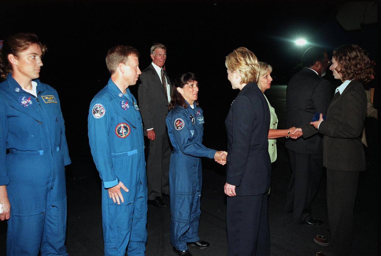 First Lady Hillary Rodham Clinton is greeted by Astronaut Nancy Jane Currie upon Mrs. Clinton's arrival at the Skid Strip at Cape Canaveral Air Station. Waiting at left are Astronauts Heidemarie M. Stefanyshyn-Piper and Steven W. Lindsey. Mrs. Clinton and her daughter, Chelsea (far right) are here to view the launch of Space Shuttle mission STS-93, scheduled for 12:36 a.m. EDT July 20. Much attention has been generated over the launch due to Commander Eileen M. Collins, the first woman to serve as commander of a Shuttle mission. The primary payload of the five-day mission is the Chandra X-ray Observatory, which will allow scientists from around the world to study some of the most distant, powerful and dynamic objects in the universe. The new telescope is 20 to 50 times more sensitive than any previous X-ray telescope and is expected to unlock the secrets of supernovae, quasars and black holes