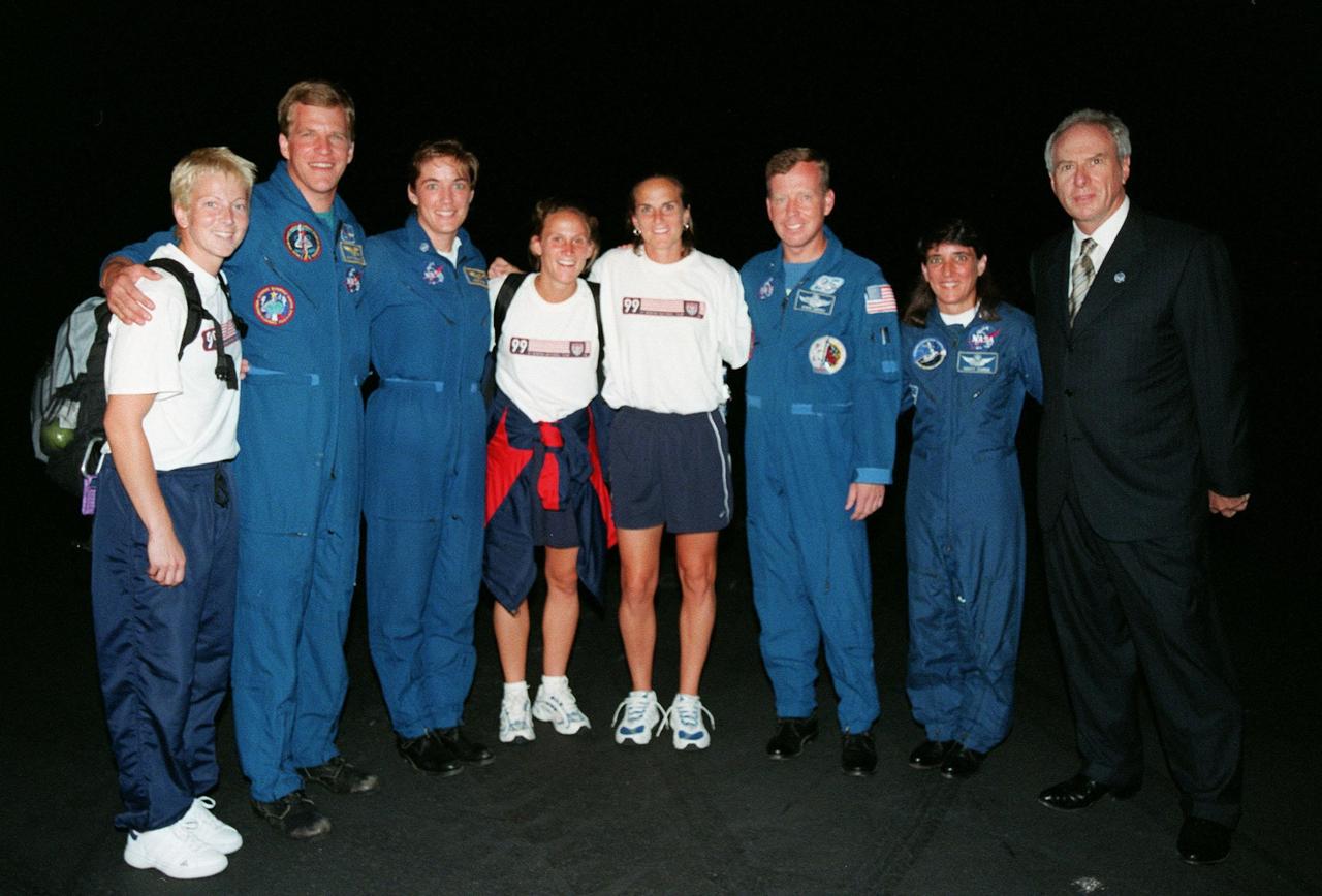 Members of the U.S. World Cup Soccer Team pose with Astronauts Scott Parazynski, Heidemarie M. Stefanyshyn-Piper, Steven W. Lindsey, and Nancy Jane Currie and NASA Administrator Daniel Goldin after the team's arrival at the Skid Strip at Cape Canaveral Air Station. The team arrived with First Lady Hillary Rodham Clinton to view the launch of Space Shuttle mission STS-93. Liftoff is scheduled for 12:36 a.m. EDT July 20. Much attention has been generated over the launch due to Commander Eileen M. Collins, the first woman to serve as commander of a Shuttle mission. The primary payload of the five-day mission is the Chandra X-ray Observatory, which will allow scientists from around the world to study some of the most distant, powerful and dynamic objects in the universe. The new telescope is 20 to 50 times more sensitive than any previous X-ray telescope and is expected to unlock the secrets of supernovae, quasars and black holes