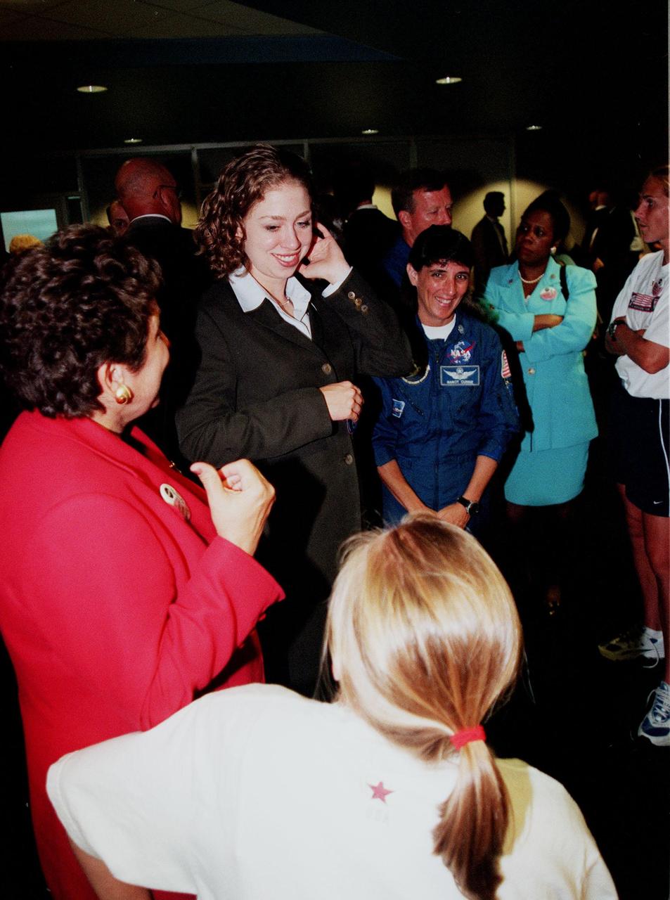 Generating her own attention waiting for the launch of STS-93 at the VIP viewing site is Chelsea Clinton, daughter of the President and Mrs. Clinton. The First Lady and Chelsea arrived earlier to view the launch. Much attention has been generated over STS-93 due to Commander Eileen M. Collins, the first woman to serve as commander of a Shuttle mission. The primary payload of the five-day mission is the Chandra X-ray Observatory, which will allow scientists from around the world to study some of the most distant, powerful and dynamic objects in the universe. The new telescope is 20 to 50 times more sensitive than any previous X-ray telescope and is expected to unlock the secrets of supernovae, quasars and black holes. Liftoff of Space Shuttle Columbia is scheduled for 12:36 a.m. EDT July 20