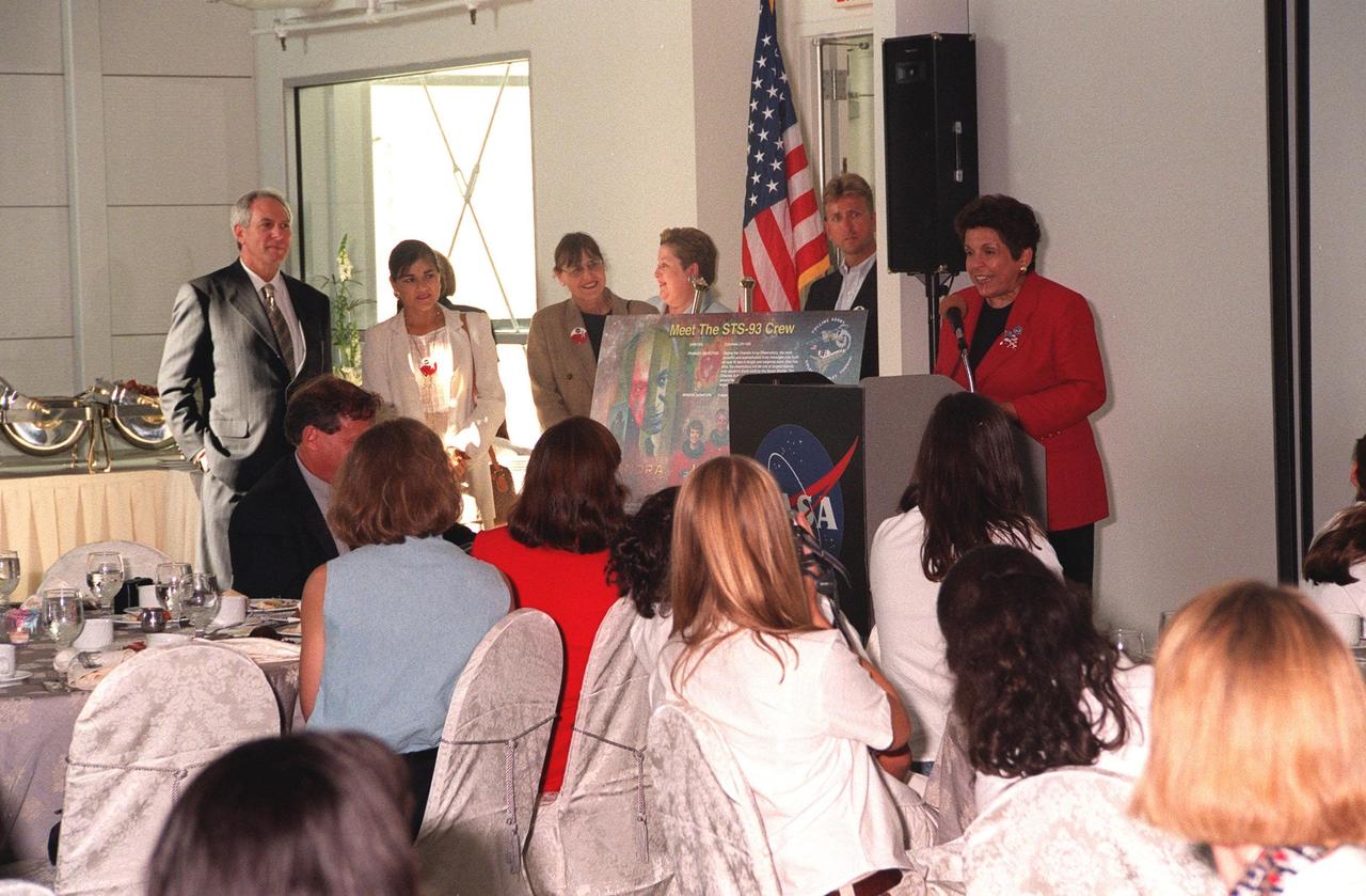 KENNEDY SPACE CENTER, FLA. -- At a women's forum held in the Apollo/Saturn V Center, Donna Shalala, secretary of Department of Health and Human Services, addresses the attendees. At the far left is NASA Administrator Daniel Goldin. Participants in a panel discussion, "Past, Present and Future of Space," include former astronaut Sally Ride; Marta Bohn-Meyer, the first SR-71 female pilot; Kathryn Sullivan, Ph.D., the first American woman to walk in space; Donna Shirley, Ph.D., the first woman leading the Mars Exploration Program; astronaut Yvonne Cagle; Jennifer Harris, flight director, Mars Pathfinder; astronaut Ellen Ochoa, the first Hispanic female in space and member of the President's commission on the Celebration of Women in American History. The forum included a welcome by Center Director Roy Bridges and remarks by Goldin. The attendees are planning to view the launch of STS-93 at the Banana Creek viewing sight. Much attention has been generated over the launch due to Commander Eileen M. Collins, the first woman to serve as commander of a Shuttle mission. The primary payload of the five-day mission is the Chandra X-ray Observatory, which will allow scientists from around the world to study some of the most distant, powerful and dynamic objects in the universe. Liftoff is scheduled for July 20 at 12:36 a.m. EDT