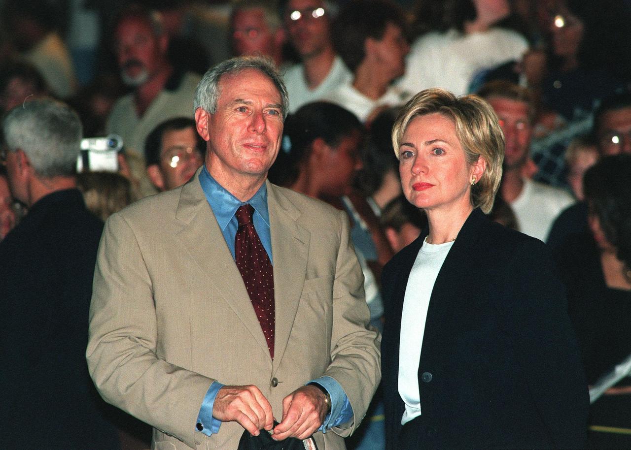 NASA Administrator Daniel Goldin and First Lady Hillary Rodham Clinton are among the spectators at the Banana Creek viewing site to watch the launch of STS-93, the second attempt. Moments before the first scheduled launch, July 20, STS-93 was scrubbed at the T-7 second mark in the countdown due to an indication of a high concentration of hydrogen in an aft engine compartment. The reading proved to be a false alarm. The launch was rescheduled for July 22 at 12:28 a.m. Much attention has been generated over STS-93 due to Commander Eileen M. Collins, the first woman to serve as commander of a Shuttle mission. The primary payload of the five-day mission is the Chandra X-ray Observatory, which will allow scientists from around the world to study some of the most distant, powerful and dynamic objects in the universe
