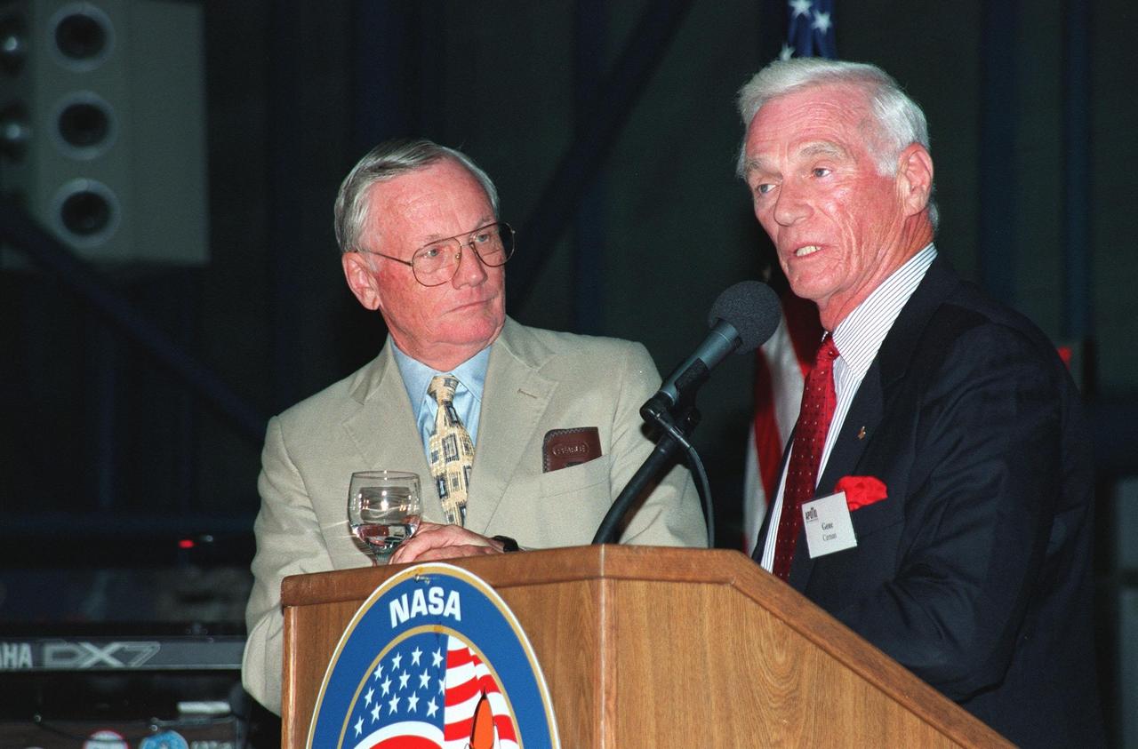 KENNEDY SPACE CENTER, FLA. -- During an anniversary banquet honoring the Apollo program team, the people who made the entire lunar landing program possible, former Apollo astronauts Neil Armstrong (left) and Gene Cernan talk about their experiences. The banquet was held in the Apollo/Saturn V Center, part of the KSC Visitor Complex. This is the 30th anniversary of the Apollo 11 launch and moon landing, July 16 and July 20, 1969. Other guests at the banquet were astronauts Wally Schirra, Edwin "Buzz" Aldrin and Walt Cunningham. Neil Armstrong was the first man to walk on the moon; Gene Cernan was the last