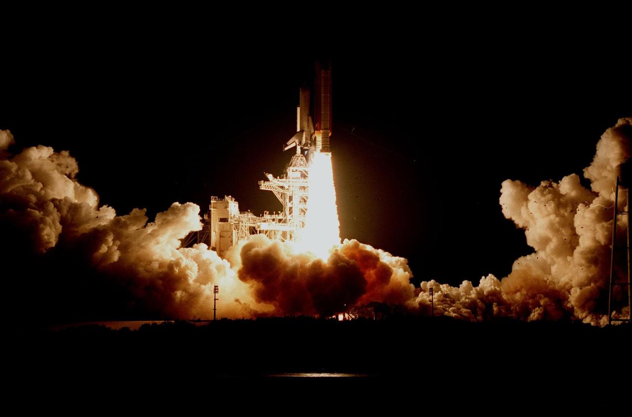 KENNEDY SPACE CENTER, FLA. -- The fiery launch of Space Shuttle Columbia lights up the night sky on its successful liftoff from Launch Pad 39-B on mission STS-93. Liftoff occurred at 12:31 a.m. EDT. STS-93 is a five-day mission primarily to release the Chandra X-ray Observatory, which will allow scientists from around the world to study some of the most distant, powerful and dynamic objects in the universe. The crew numbers five: Commander Eileen M. Collins, Pilot Jeffrey S. Ashby, and Mission Specialists Steven A. Hawley (Ph.D.), Catherine G. Coleman (Ph.D.) and Michel Tognini of France, with the Centre National d'Etudes Spatiales (CNES). Collins is the first woman to serve as commander of a Shuttle mission. The target landing date is July 27, 1999, at 11:20 p.m. EDT