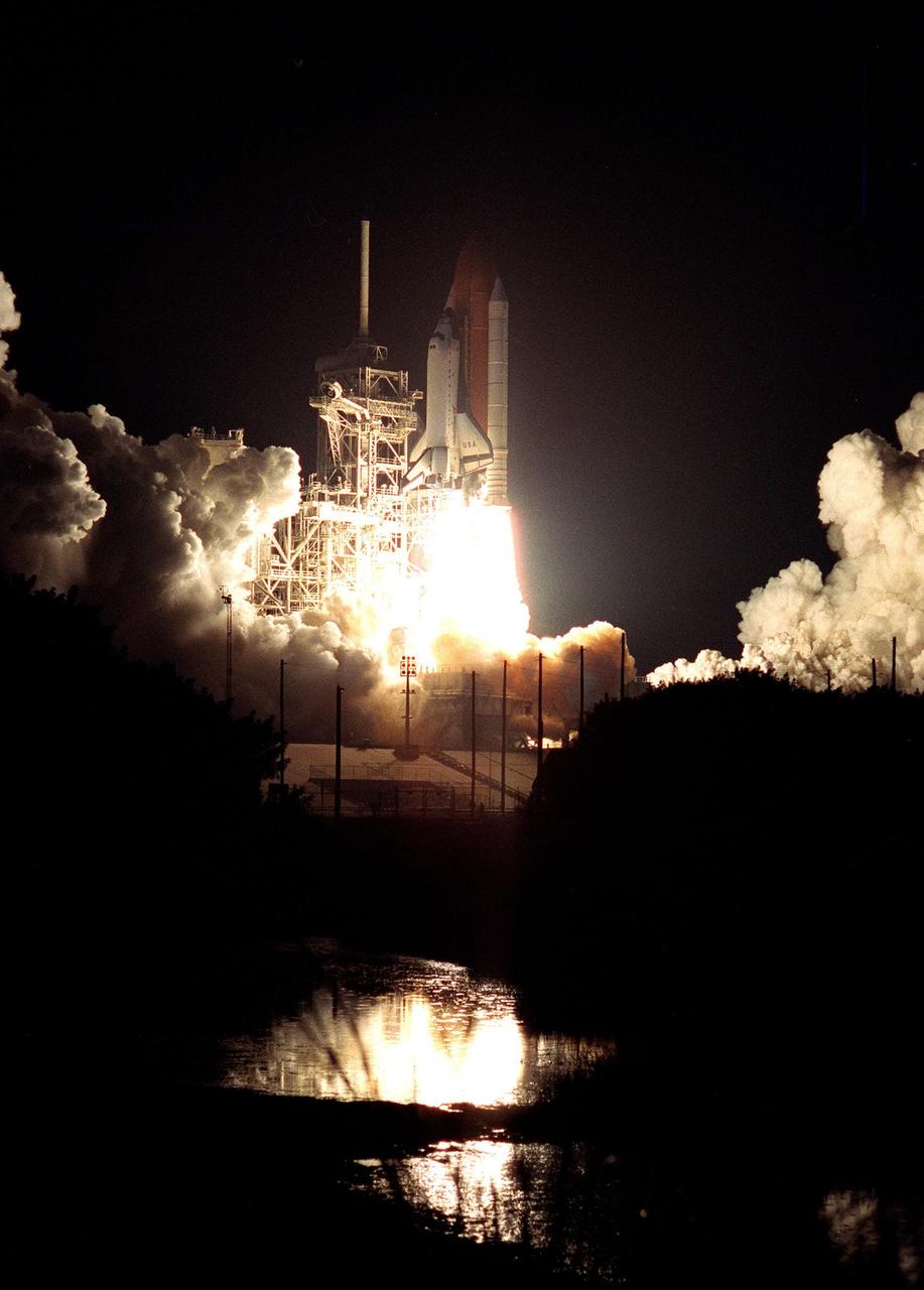 KENNEDY SPACE CENTER, FLA. -- Space Shuttle Columbia changes night into day as it roars into the sky after a successful liftoff from launch Pad 39-B on mission STS-93. Liftoff occurred at 12:31 a.m. EDT. STS-93 is a five-day mission primarily to release the Chandra X-ray Observatory, which will allow scientists from around the world to study some of the most distant, powerful and dynamic objects in the universe. The crew numbers five: Commander Eileen M. Collins, Pilot Jeffrey S. Ashby, and Mission Specialists Steven A. Hawley (Ph.D.), Catherine G. Coleman (Ph.D.) and Michel Tognini of France, with the Centre National d'Etudes Spatiales (CNES). Collins is the first woman to serve as commander of a Shuttle mission. The target landing date is July 27, 1999, at 11:20 p.m. EDT