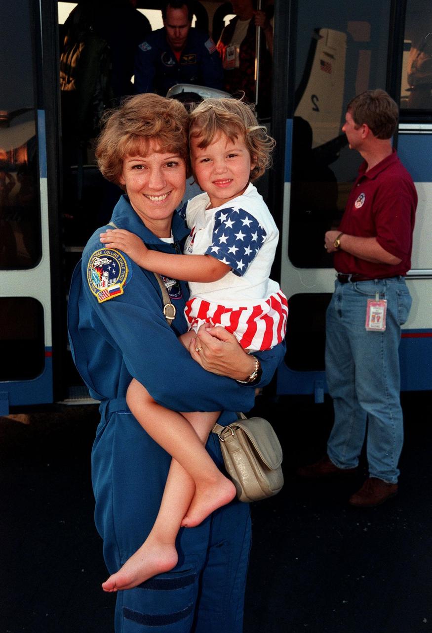 At the Skid Strip at the Cape Canaveral Air Station, Commander Eileen Collins and her daughter, Bridget Youngs, prepare to board an aircraft for their return flight to Houston following the completion of the STS-93 Space Shuttle mission. Landing occurred on runway 33 at KSC's Shuttle Landing Facility on July 27 with main gear touchdown at 11:20:35 p.m. EDT. The mission's primary objective was to deploy the Chandra X-ray Observatory, which will allow scientists from around the world to study some of the most distant, powerful and dynamic objects in the universe. This was the 95th flight in the Space Shuttle program and the 26th for Columbia. The landing was the 19th consecutive Shuttle landing in Florida and the 12th night landing in Shuttle program history. On this mission, Collins became the first woman to serve as a Shuttle commander
