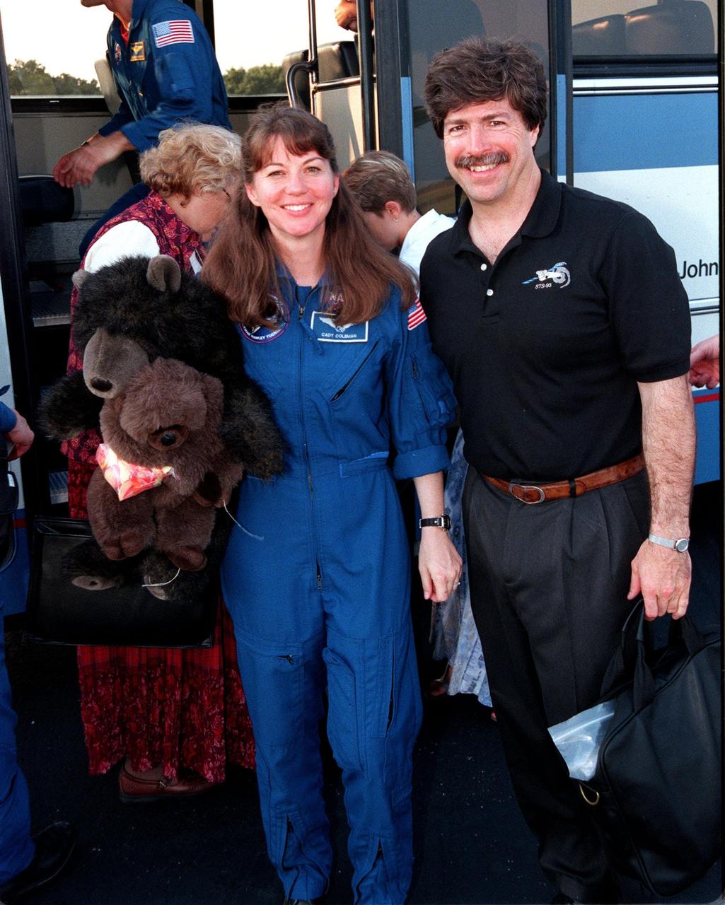At the Skid Strip at the Cape Canaveral Air Station, Mission Specialist Catherine G. Coleman (Ph.D.) and her husband, Josh Simpson, prepare to board an aircraft for their return flight to Houston following the completion of the STS-93 Space Shuttle mission. Landing occurred on runway 33 at KSC's Shuttle Landing Facility on July 27 with main gear touchdown at 11:20:35 p.m. EDT. The mission's primary objective was to deploy the Chandra X-ray Observatory, which will allow scientists from around the world to study some of the most distant, powerful and dynamic objects in the universe. This was the 95th flight in the Space Shuttle program and the 26th for Columbia. The landing was the 19th consecutive Shuttle landing in Florida and the 12th night landing in Shuttle program history. On this mission, Eileen Collins became the first woman to serve as a Shuttle commander