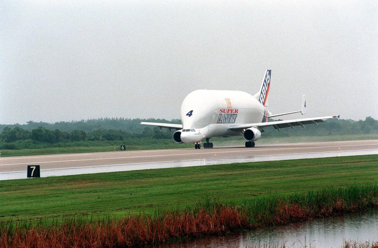 KENNEDY SPACE CENTER, FLA. -- An Airbus Industrie A300-600ST "Beluga" Super Transporter touches down at the Shuttle Landing Facility to deliver its cargo, the second Multi-Purpose Logistics Module (MPLM) for the International Space Station (ISS). One of Italy's major contributions to the ISS program, the MPLM, named Raffaello, is a reusable logistics carrier and the primary delivery system used to resupply and return station cargo requiring a pressurized environment. Weighing nearly 4.5 tons, the module measures 21 feet long and 15 feet in diameter. Raffaello will join Leonardo, the first Italian-built MPLM, in the Space Station Processing Facility for testing. NASA, Boeing, the Italian Space Agency and Alenia Aerospazio will provide engineering support