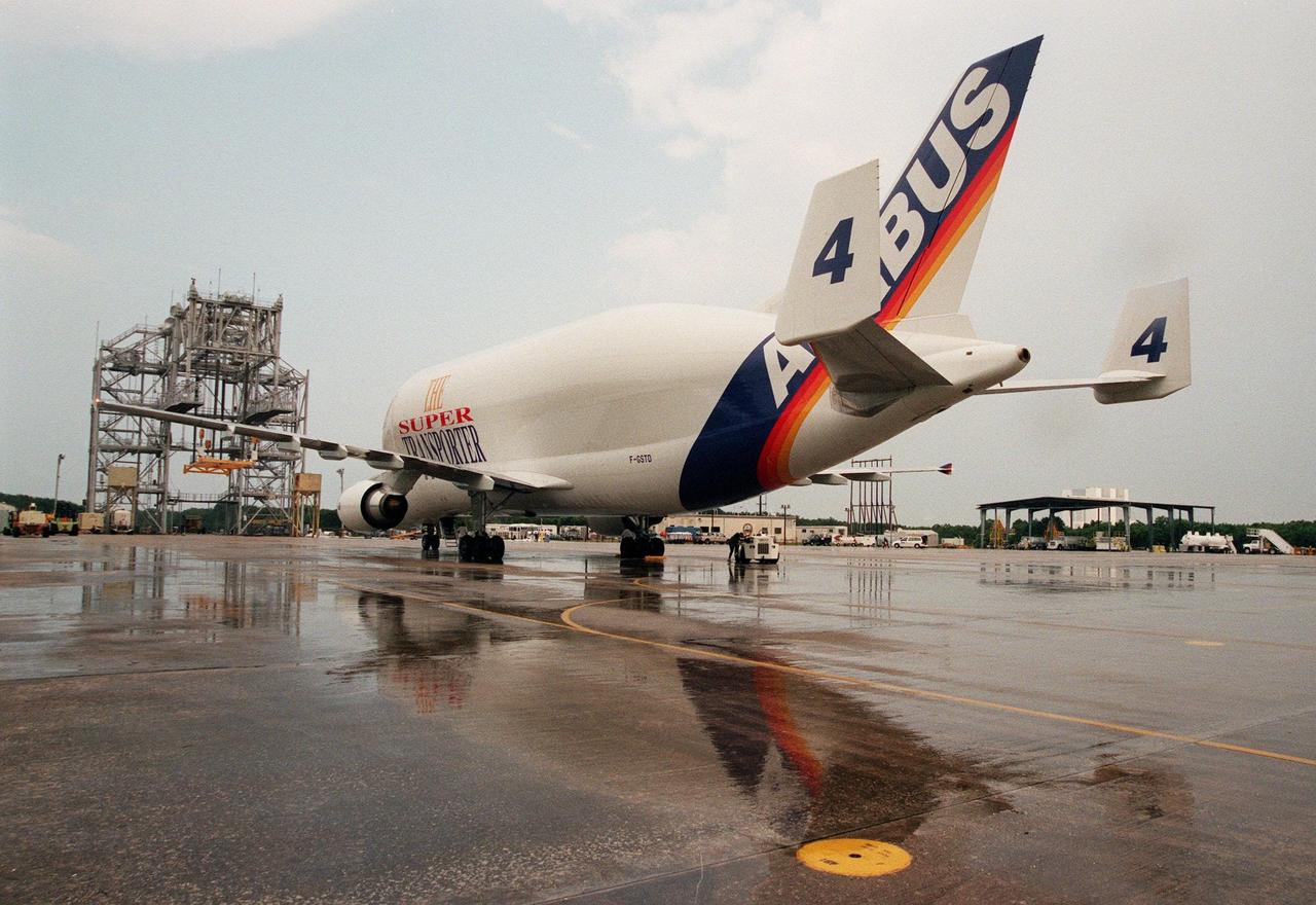 KENNEDY SPACE CENTER, FLA. -- An Airbus Industrie A300-600ST "Beluga" Super Transporter is reflected in the rain puddles as it taxis toward the mate/demate tower at the Shuttle Landing Facility. The Beluga is carrying the Raffaello, the second Multi-Purpose Logistics Module (MPLM) for the International Space Station (ISS). One of Italy's major contributions to the ISS program, the MPLM is a reusable logistics carrier and the primary delivery system used to resupply and return station cargo requiring a pressurized environment. Weighing nearly 4.5 tons, the module measures 21 feet long and 15 feet in diameter. Raffaello will join Leonardo, the first Italian-built MPLM, in the Space Station Processing Facility for testing. NASA, Boeing, the Italian Space Agency and Alenia Aerospazio will provide engineering support
