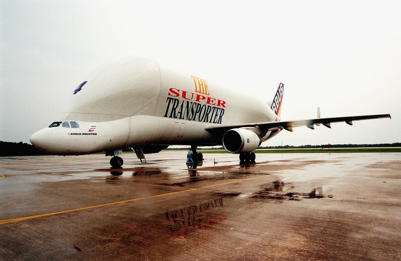 KENNEDY SPACE CENTER, FLA. -- An Airbus Industrie A300-600ST "Beluga" Super Transporter is reflected in the rain puddles as it comes to a stop at the Shuttle Landing Facility. The Beluga is carrying the Raffaello, the second Multi-Purpose Logistics Module (MPLM) for the International Space Station (ISS). One of Italy's major contributions to the ISS program, the MPLM is a reusable logistics carrier and the primary delivery system used to resupply and return station cargo requiring a pressurized environment. Weighing nearly 4.5 tons, the module measures 21 feet long and 15 feet in diameter. Raffaello will join Leonardo, the first Italian-built MPLM, in the Space Station Processing Facility for testing. NASA, Boeing, the Italian Space Agency and Alenia Aerospazio will provide engineering support