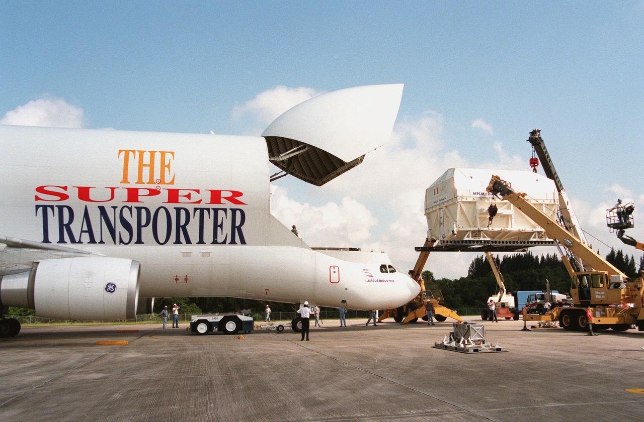 KENNEDY SPACE CENTER, FLA. -- The second Multi-Purpose Logistics Module (MPLM) for the International Space Station (ISS), named Raffaello, is moved out of the "Beluga" Super Transporter at the Shuttle Landing Facility. One of Italy's major contributions to the ISS program, the MPLM is a reusable logistics carrier and the primary delivery system used to resupply and return station cargo requiring a pressurized environment. Weighing nearly 4.5 tons, the module measures 21 feet long and 15 feet in diameter. Raffaello will join Leonardo, the first Italian-built MPLM, in the Space Station Processing Facility for testing. NASA, Boeing, the Italian Space Agency and Alenia Aerospazio will provide engineering support