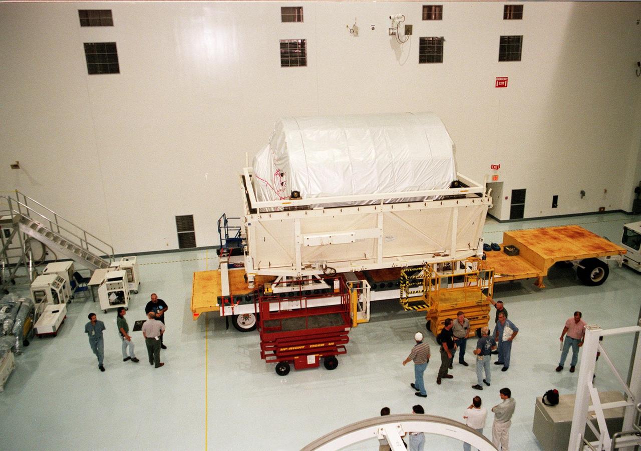 KENNEDY SPACE CENTER, FLA. -- Inside a high bay in the Space Station Processing Facility (SSPF), the Multi-Purpose Logistics Module (MPLM) called Raffaello waits for transfer to a workstand. There it will undergo testing, joining the first Italian-built MPLM, Leonardo, in the SSPF. One of Italy's major contributions to the ISS program, the MPLM is a reusable logistics carrier and the primary delivery system used to resupply and return station cargo requiring a pressurized environment. Weighing nearly 4.5 tons, the Raffaello measures 21 feet long and 15 feet in diameter. Raffaello is scheduled to be launched on mission STS-100 July 27, 2000