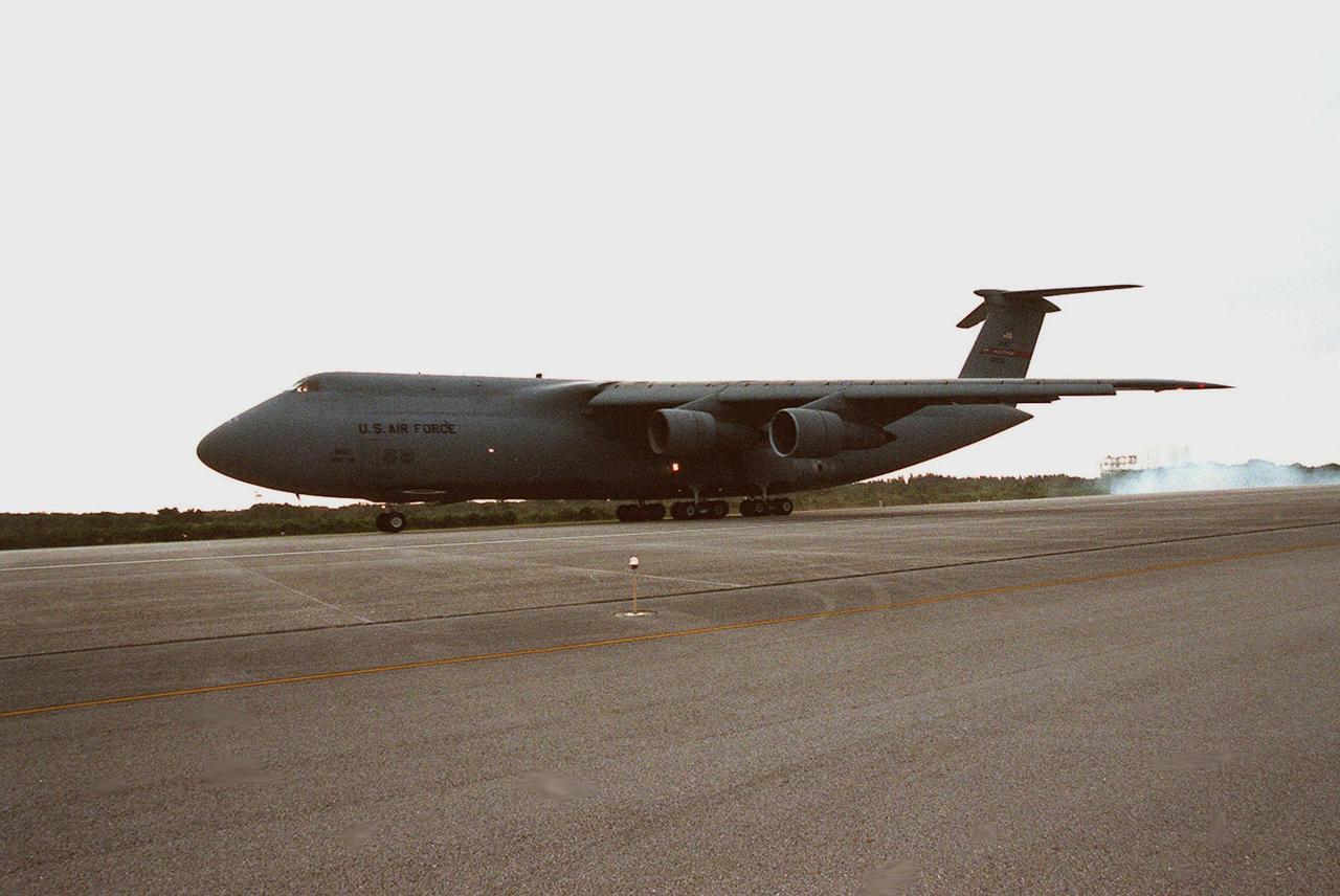 A C-5 air cargo plane lands at Kennedy Space Center carrying the payload flight hardware for the Third Hubble Space Telescope Servicing Mission (SM-3A). The hardware will be taken to the Payload Hazardous Servicing Facility for final testing and integration of payload elements. Mission STS-103 is a "call-up" mission which is being planned due to the need to replace portions of the Hubble's pointing system, the gyros, which have begun to fail. Although Hubble is operating normally and conducting its scientific observations, only three of its six gyroscopes are working properly. The gyroscopes allow the telescope to point at stars, galaxies and planets. The STS-103 crew will not only replace gyroscopes, it will also replace a Fine Guidance Sensor and an older computer with a new enhanced model, an older data tape recorder with a solid state digital recorder, a failed spare transmitter with a new one, and degraded insulation on the telescope with new thermal insulation. The crew will also install a Battery Voltage/Temperature Improvement Kit to protect the spacecraft batteries from overcharging and overheating when the telescope goes into a safe mode. Launch of STS-93 is currently targeted for Oct. 14 but under review, pending the launch date of a prior mission, STS-99, also under review