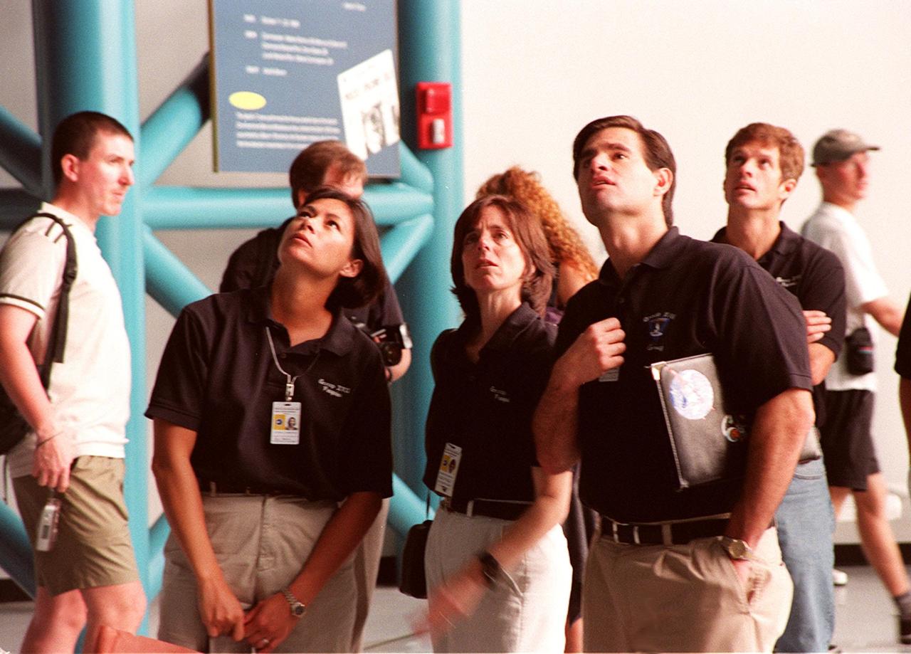 KENNEDY SPACE CENTER, FLA. -- Some of the 1998 astronaut candidate class (group 17) take a close look at displays in the Apollo/Saturn V Center at KSC. The U.S. candidates include Clayton C. Anderson, Lee J. Archambault, Tracy E. Caldwell (Ph.D.), Gregory E. Chamitoff (Ph.D.), Timothy J. Creamer, Christopher J. Ferguson, Michael J. Foreman, Michael E. Fossum, Kenneth T. Ham, Patricia C. Hilliard (M.D.), Gregory C. Johnson, Gregory H. Johnson, Stanley G. Love (Ph.D.), Leland D. Melvin, Barbara R. Morgan, William A. Oefelein, John D. Olivas (Ph.D.), Nicholas J.M. Patrick (Ph.D.), Alan G. Poindexter, Garrett E. Reisman (Ph.D.), Steven R. Swanson, Douglas H. Wheelock, Sunita L. Williams, Neil W. Woodward III, George D. Zamka; and international candidates Leopold Eyharts, Paolo Nespoli, Hans Schlegel, Roberto Vittori, Bjarni V. Tryggvason, and Marcos Pontes. The class is at KSC for training activities, including fire training and a flight awareness program, plus touring the OPF, SSME Processing Facility, VAB, SSPF, launch pads, SLF, Apollo/Saturn V Center and the crew headquarters