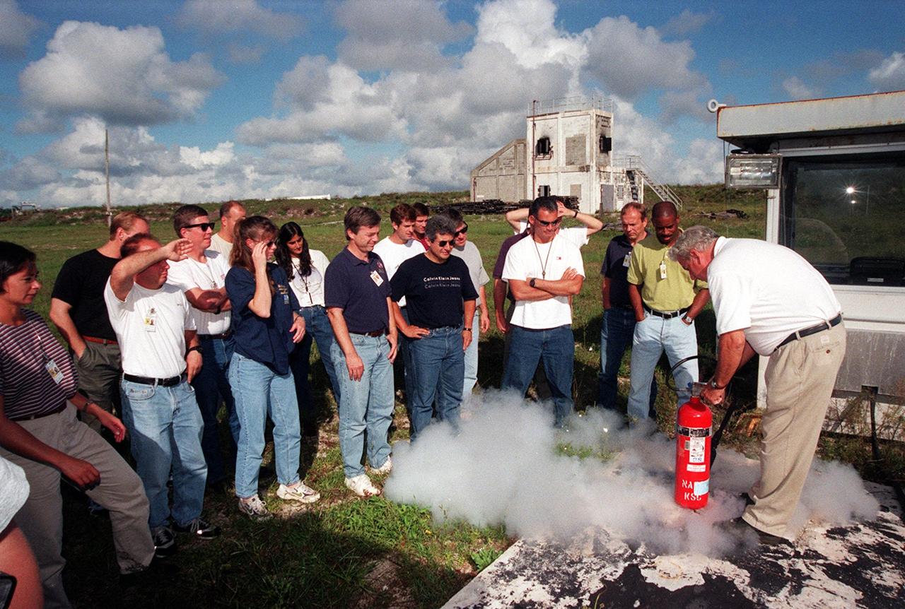 KENNEDY SPACE CENTER, FLA. -- On the grounds of the Kennedy Space Center, members of the 1998 astronaut candidate class (Group 17) take part in fire training. The class is taking part in training activities, including a flight awareness program, plus touring the OPF, VAB, SSPF, SSME Processing Facility, launch pads, SLF, Apollo/Saturn V Center, and the crew quarters. The U.S. candidates in the '98 class are Clayton C. Anderson, Lee J. Archambault, Tracy E. Caldwell (Ph.D.), Gregory E. Chamitoff (Ph.D.), Timothy J. Creamer, Christopher J. Ferguson, Michael J. Foreman, Michael E. Fossum, Kenneth T. Ham, Patricia C. Hilliard (M.D.), Gregory C. Johnson, Gregory H. Johnson, Stanley G. Love (Ph.D.), Leland D. Melvin, Barbara R. Morgan, William A. Oefelein, John D. Olivas (Ph.D.), Nicholas J.M. Patrick (Ph.D.), Alan G. Poindexter, Garrett E. Reisman (Ph.D.), Steven R. Swanson, Douglas H. Wheelock, Sunita L. Williams, Neil W. Woodward III, George D. Zamka; and the international candidates are Leopold Eyharts, Paolo Nespoli, Hans Schlegel, Roberto Vittori, Bjarni V. Tryggvason, and Marcos Pontes