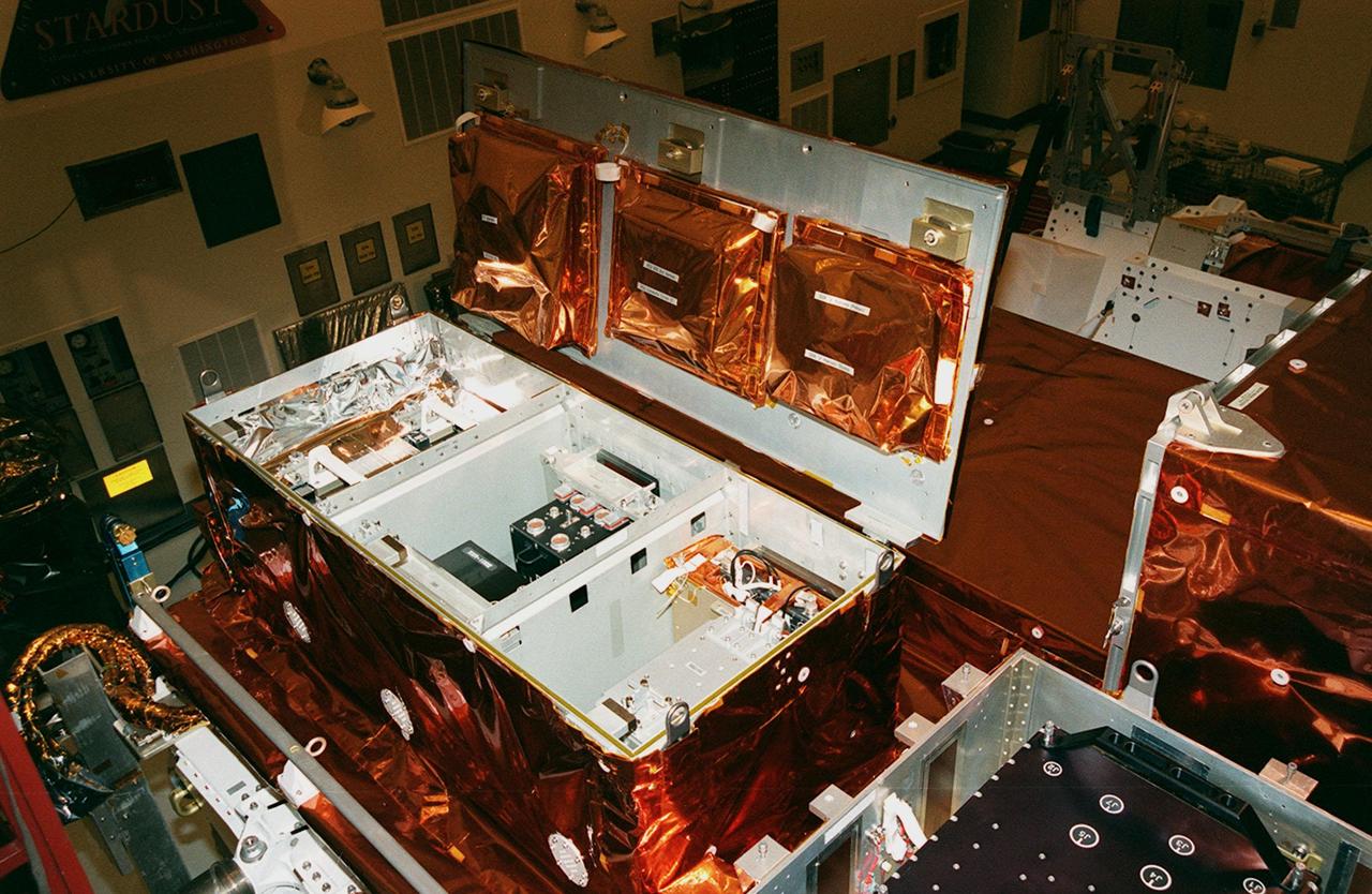 In the Payload Hazardous Servicing Facility clean room, the gyroscopes (left) and computer (right), part of the flight hardware for the Hubble Space Telescope Servicing mission, is on display for media representatives. This mission is designed to replace aging parts on the nine-year-old observatory and to upgrade some of its functioning systems. During the flight, the astronaut crew will replace all six of Hubble's gyroscopes, a fine guidance sensor, the observatory's main computer, and other equipment. The 10-day mission is scheduled to launch no earlier than Dec. 2 at 4:32 a.m. EST from Launch Complex 39
